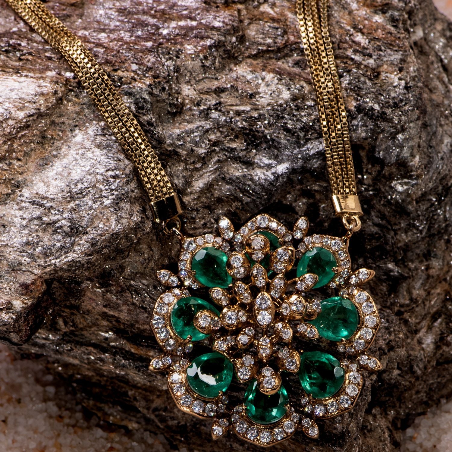 Necklace with a floral-shaped pendant adorned with Moissanite Polki stones and green tourmaline stones, elegantly attached to a delicate gold-plated chain, perfect for adding a touch of sophistication and charm to any outfit.