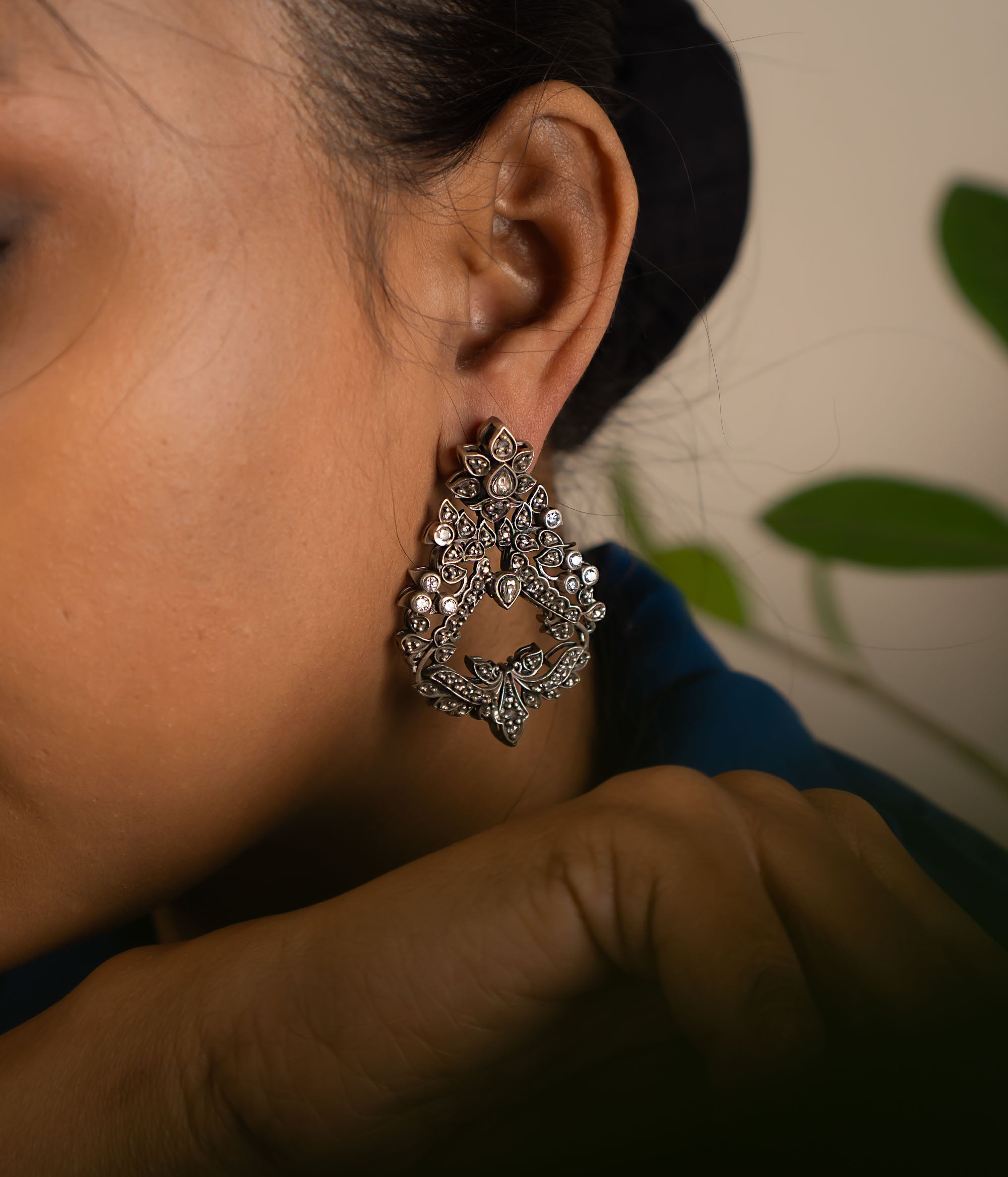 These oxidized Chandbali earrings, adorned with radiant white kundan stones, embody our commitment to crafting timeless elegance—perfect for everyday grace and lasting charm.