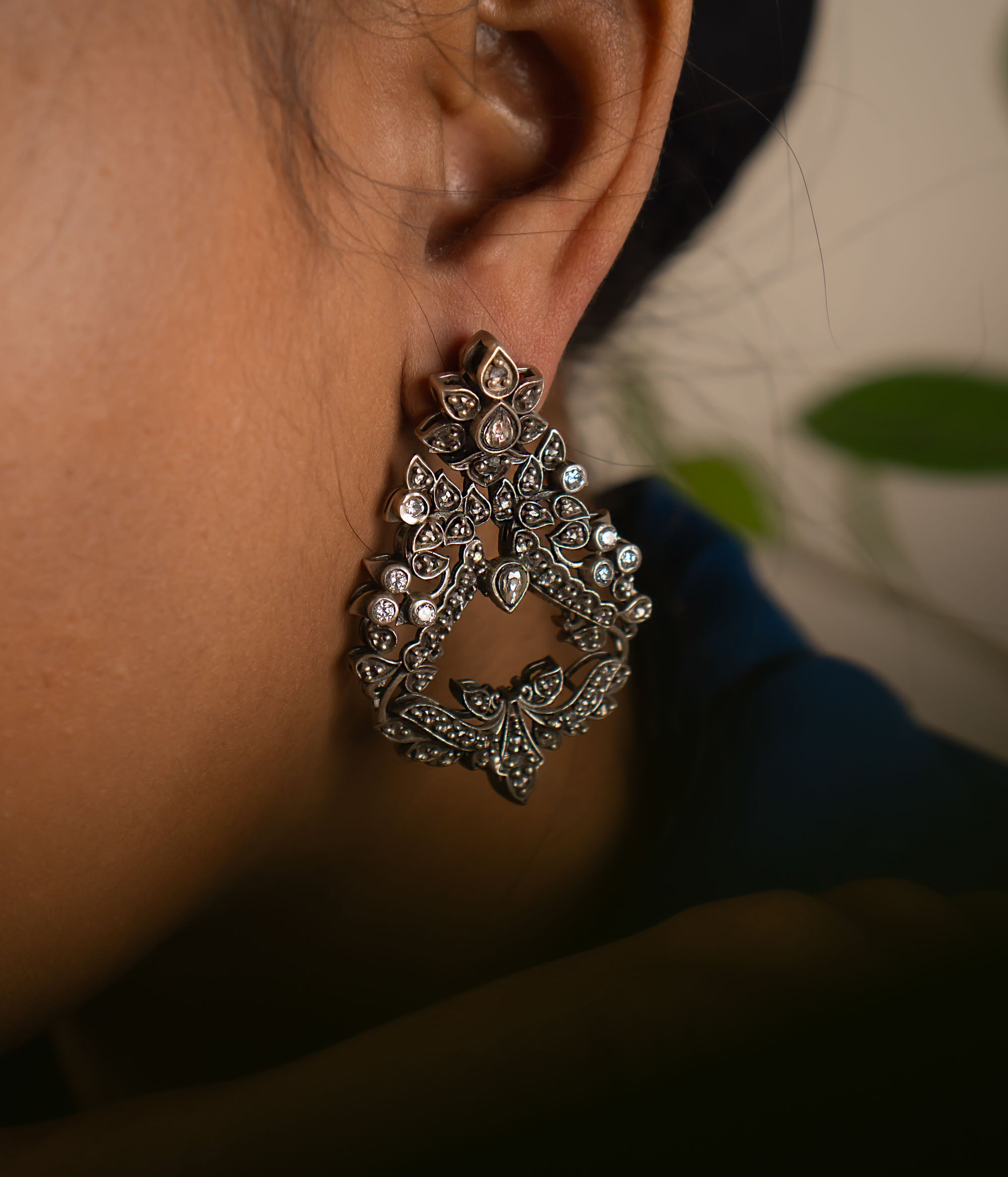 These oxidized Chandbali earrings, adorned with radiant white kundan stones, embody our commitment to crafting timeless elegance—perfect for everyday grace and lasting charm.
