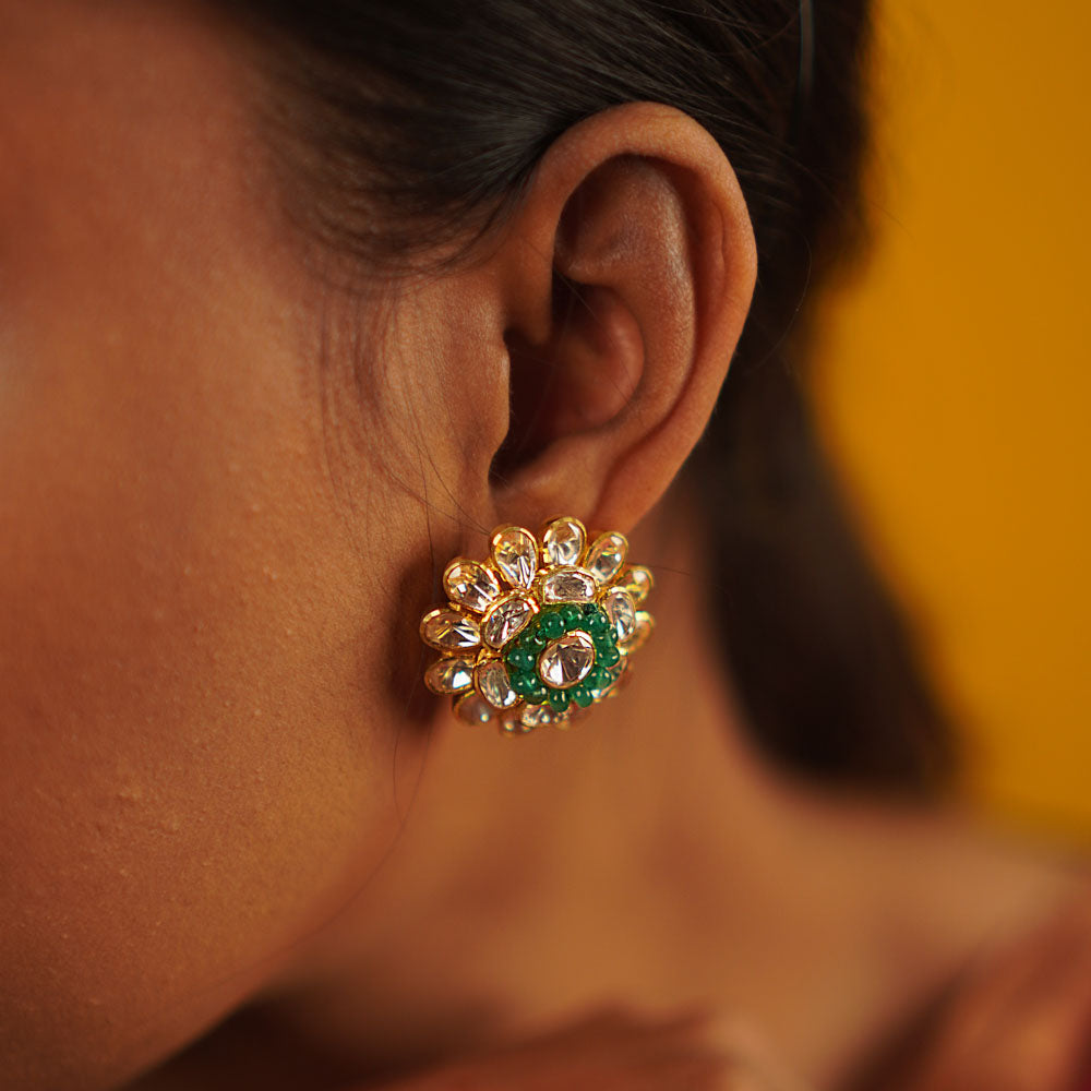 Timeless romance reimagined. The Murraya studs, crafted in gold-plated silver, showcase delicate polki florals and sparkling CZ stones—vintage charm with a contemporary touch.