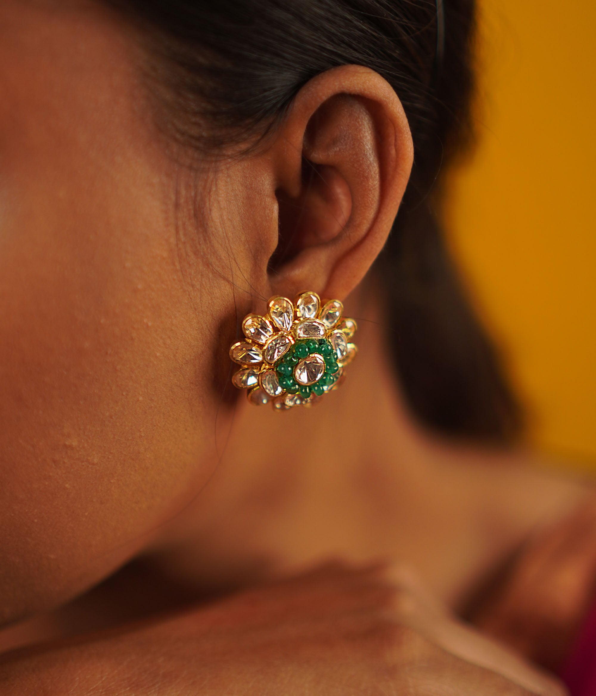 Timeless romance reimagined. The Murraya studs, crafted in gold-plated silver, showcase delicate polki florals and sparkling CZ stones—vintage charm with a contemporary touch.