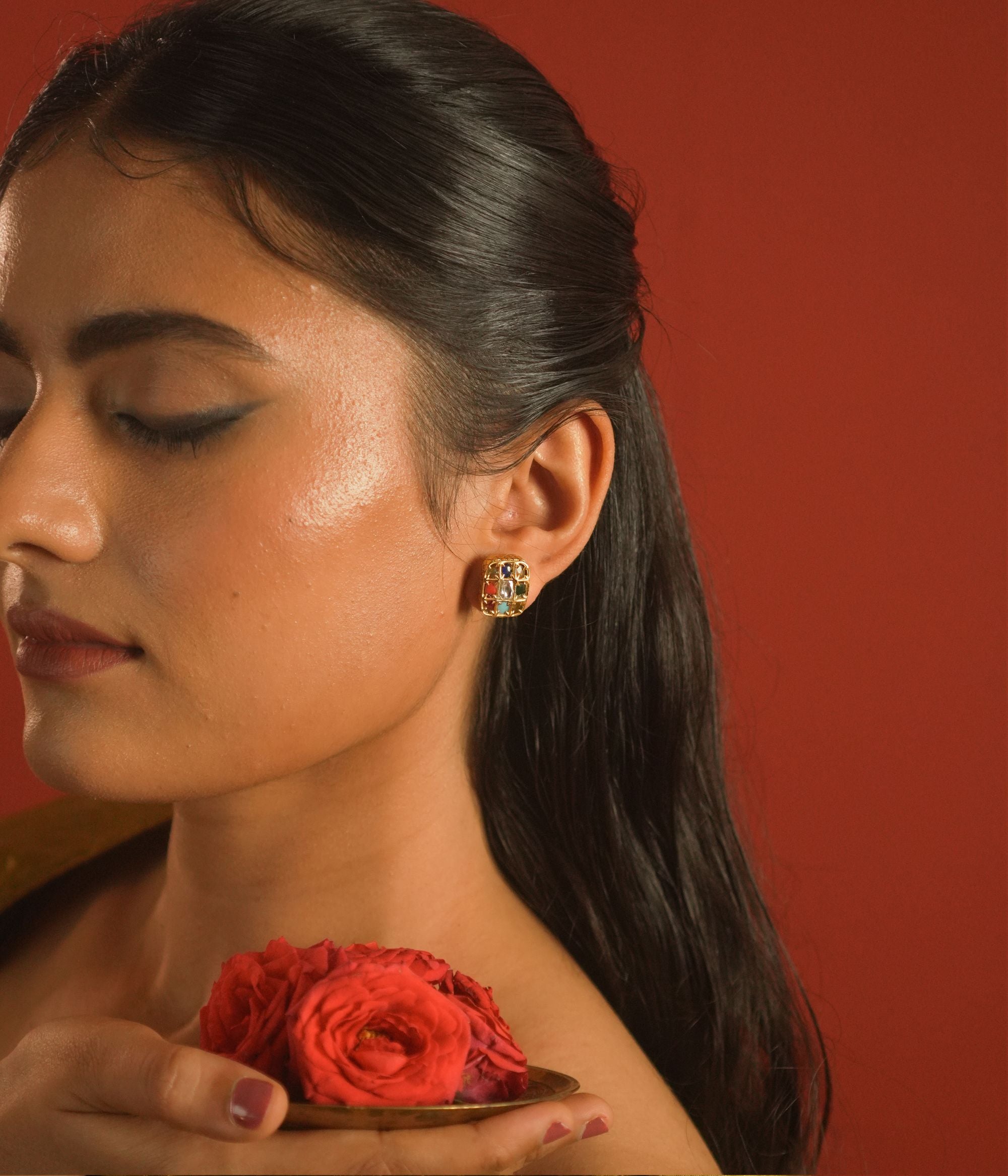 Close up view of Aria Navratna silver stud detailing