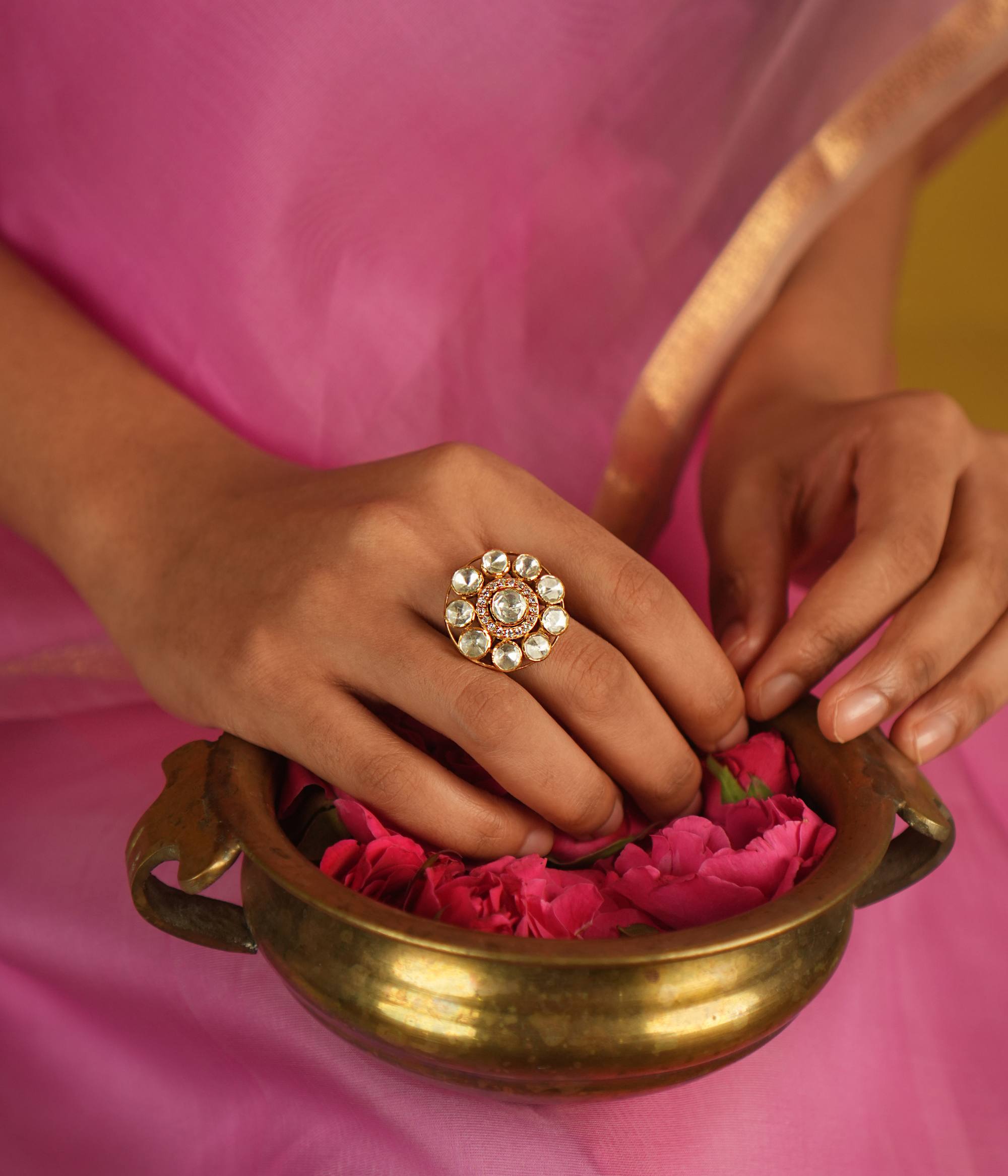 Step into timeless elegance with our round-shaped Moissanite Polki ring, featuring a beautiful blend of Polki and CZ stones. A true tribute to the craftsmanship of Mughal-era jewelry, this ring radiates vintage glamour and artistic finesse.