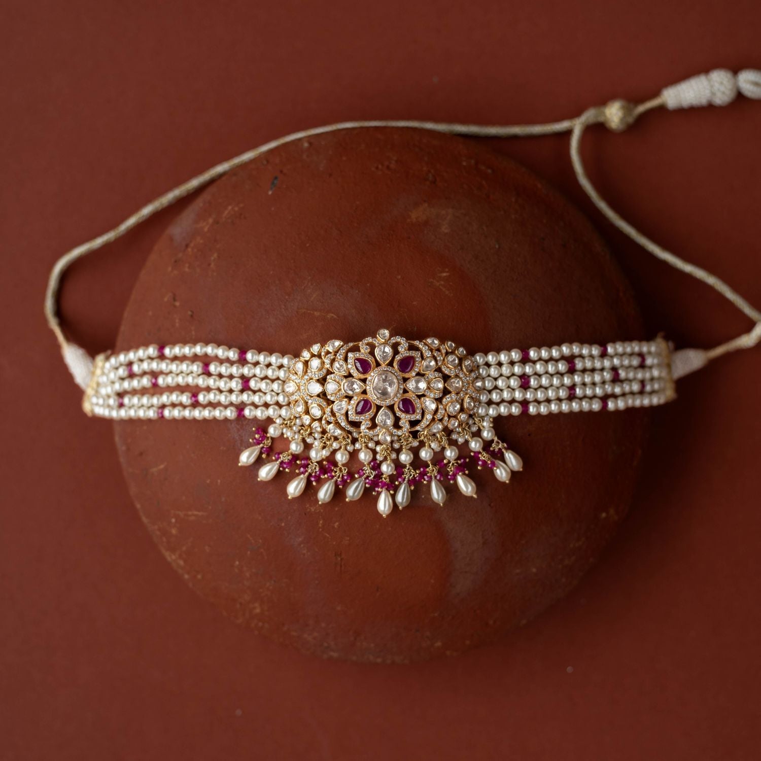 A regal masterpiece, the Neelam Choker, a symphony of Polki and sapphires , a timeless legacy.