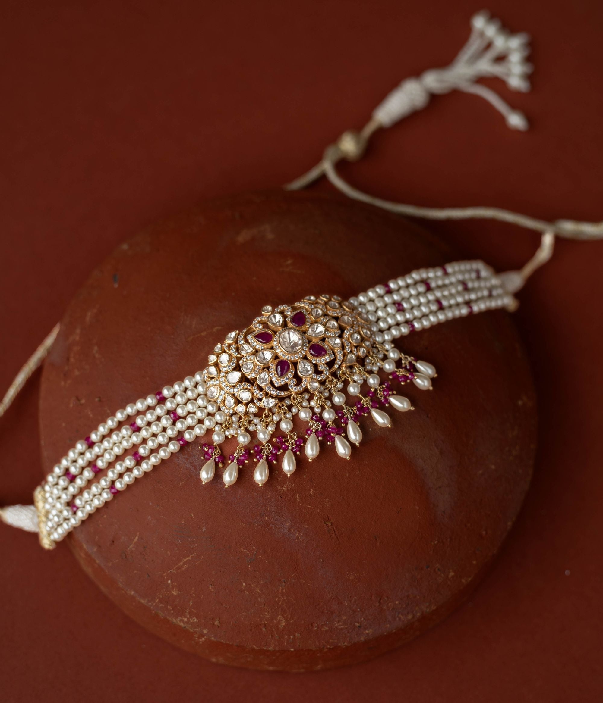 A regal masterpiece, the Neelam Choker, a symphony of Polki and sapphires , a timeless legacy.
