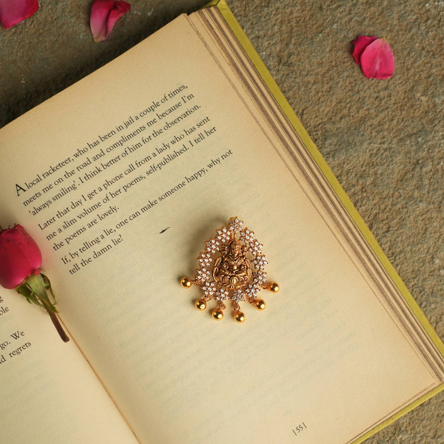 The Nehark Pendant radiates an aura of ancient wisdom, adorned with a goddess motif and golden beads. A luminous treasure, it whispers tales of forgotten realms, its mystical glow captivating the soul.