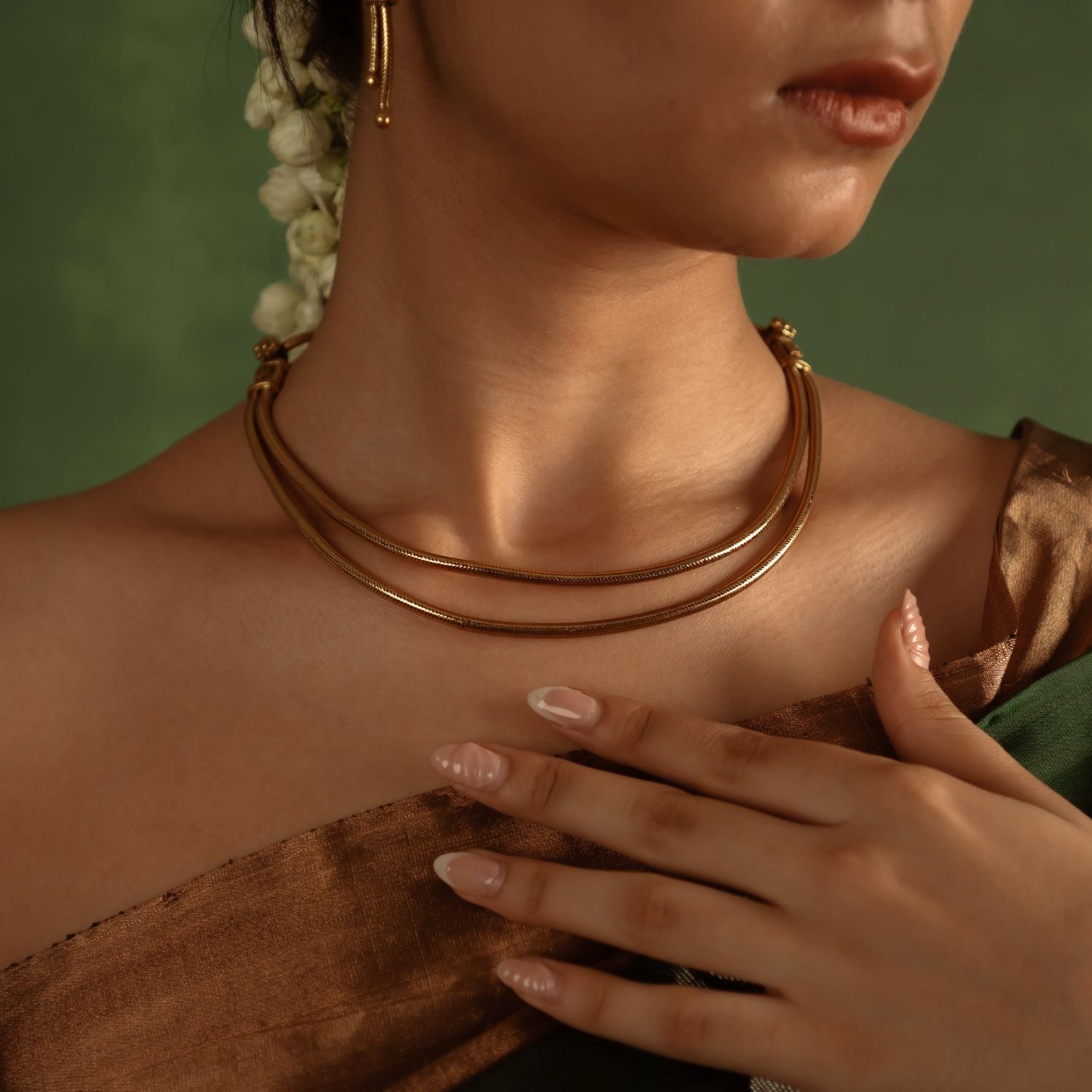 Grace your neckline with effortless elegance, honoring the timeless charm of India’s tribal heritage, beautifully crafted in antique gold-plated silver.