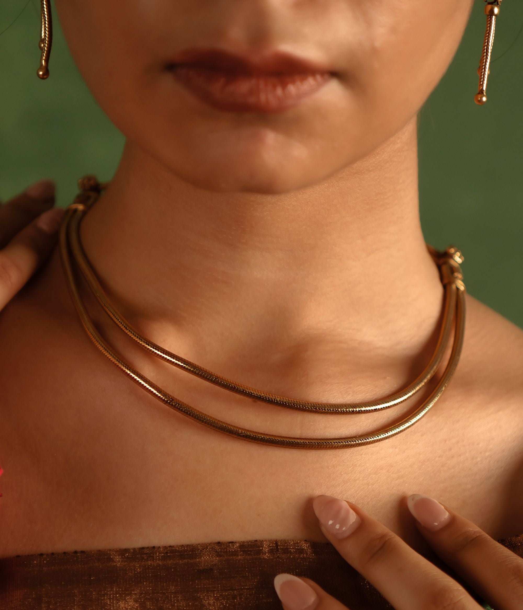 Grace your neckline with effortless elegance, honoring the timeless charm of India’s tribal heritage, beautifully crafted in antique gold-plated silver.