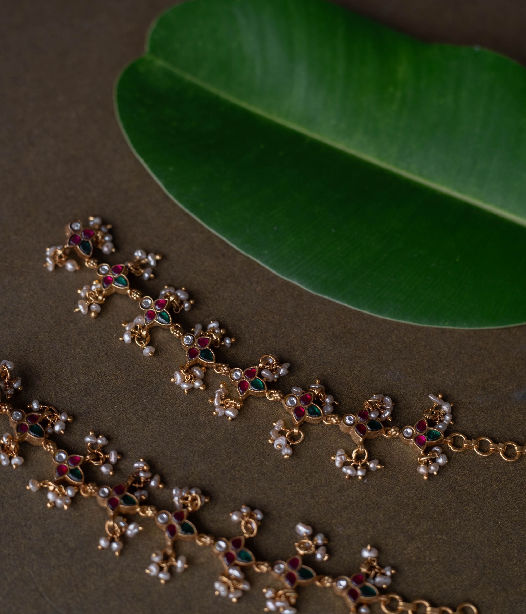 Kundan elegance handcrafted into heirloom ear chains, timeless beauty and cultural legacy intertwined delicately.