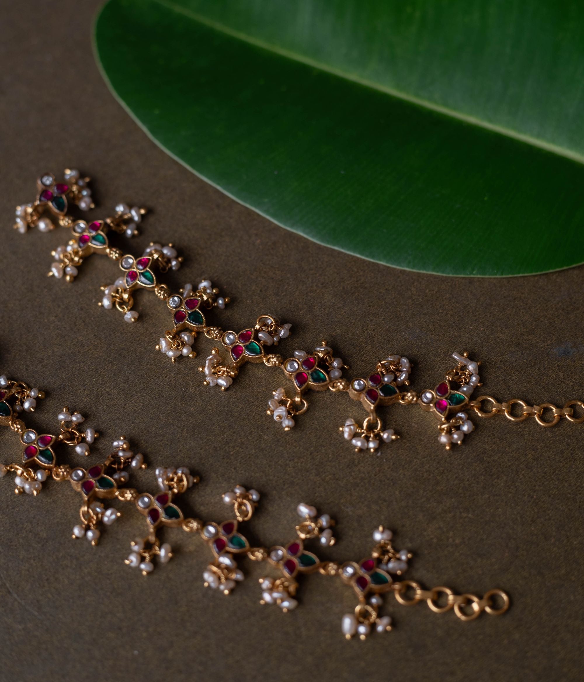 Kundan elegance handcrafted into heirloom ear chains, timeless beauty and cultural legacy intertwined delicately.
