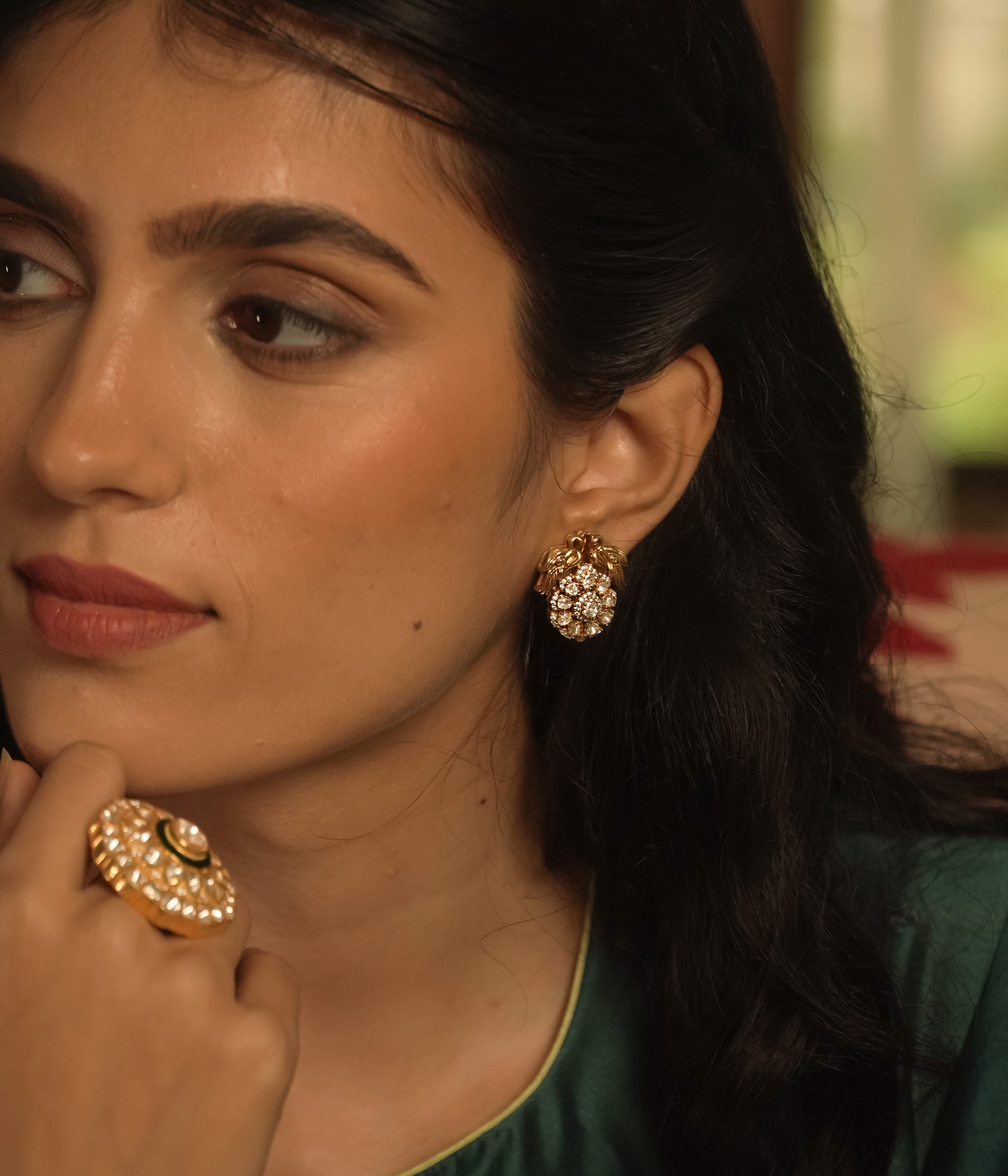 Polki stud earring with white Polki stones, CZ sparkle, and golden floral detailing.