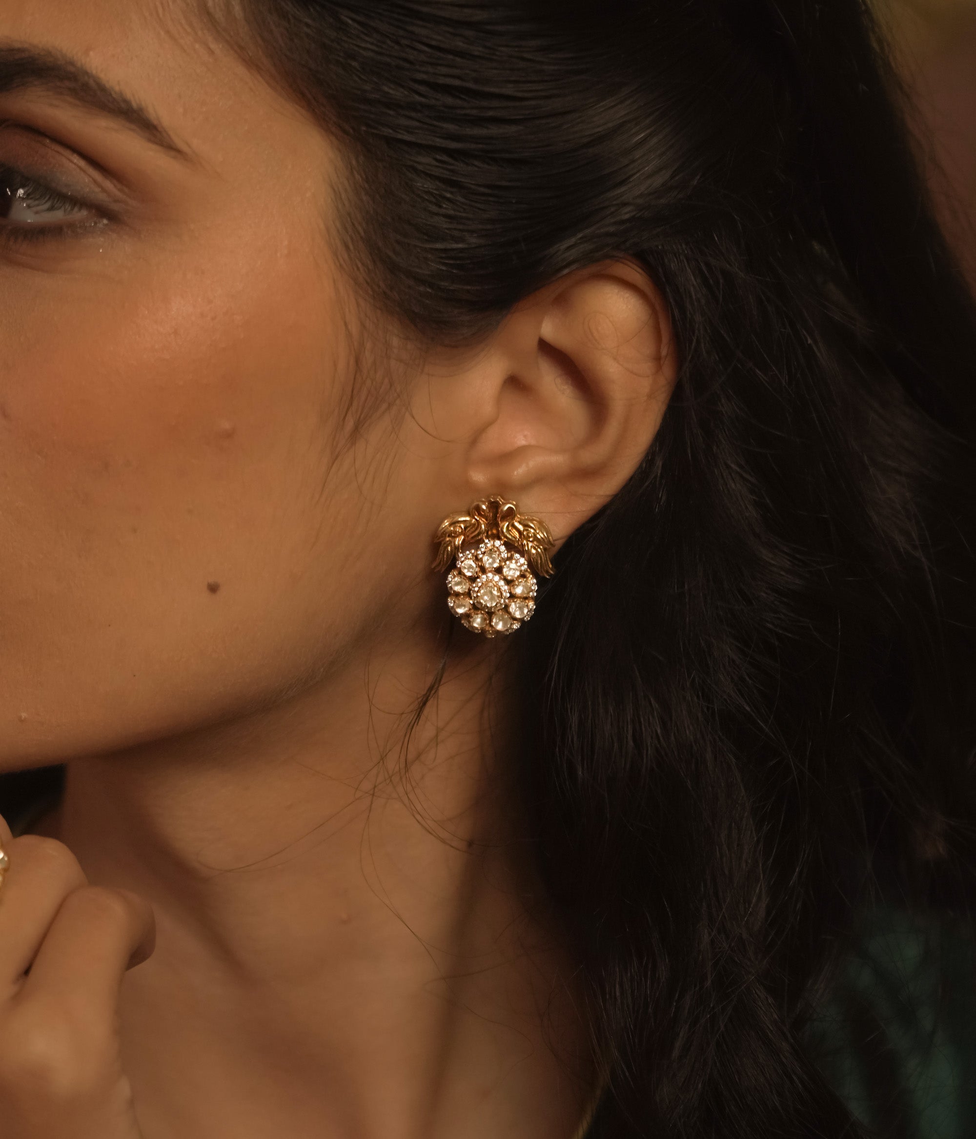 Polki stud earring with white Polki stones, CZ sparkle, and golden floral detailing.