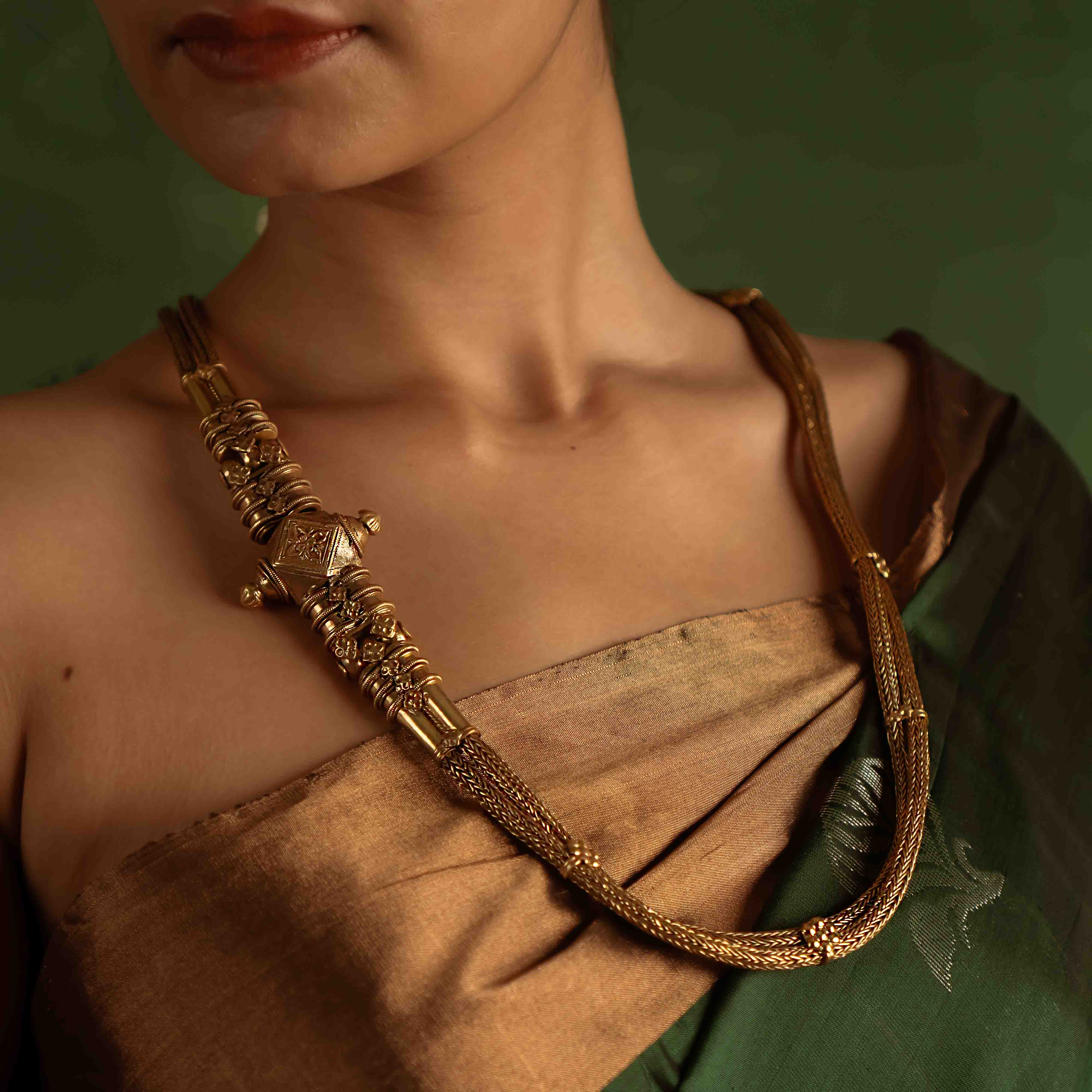 The Paras Necklace (gold-plated silver) revives tribal heritage with bold elegance, embodying strength through its vintage charm.