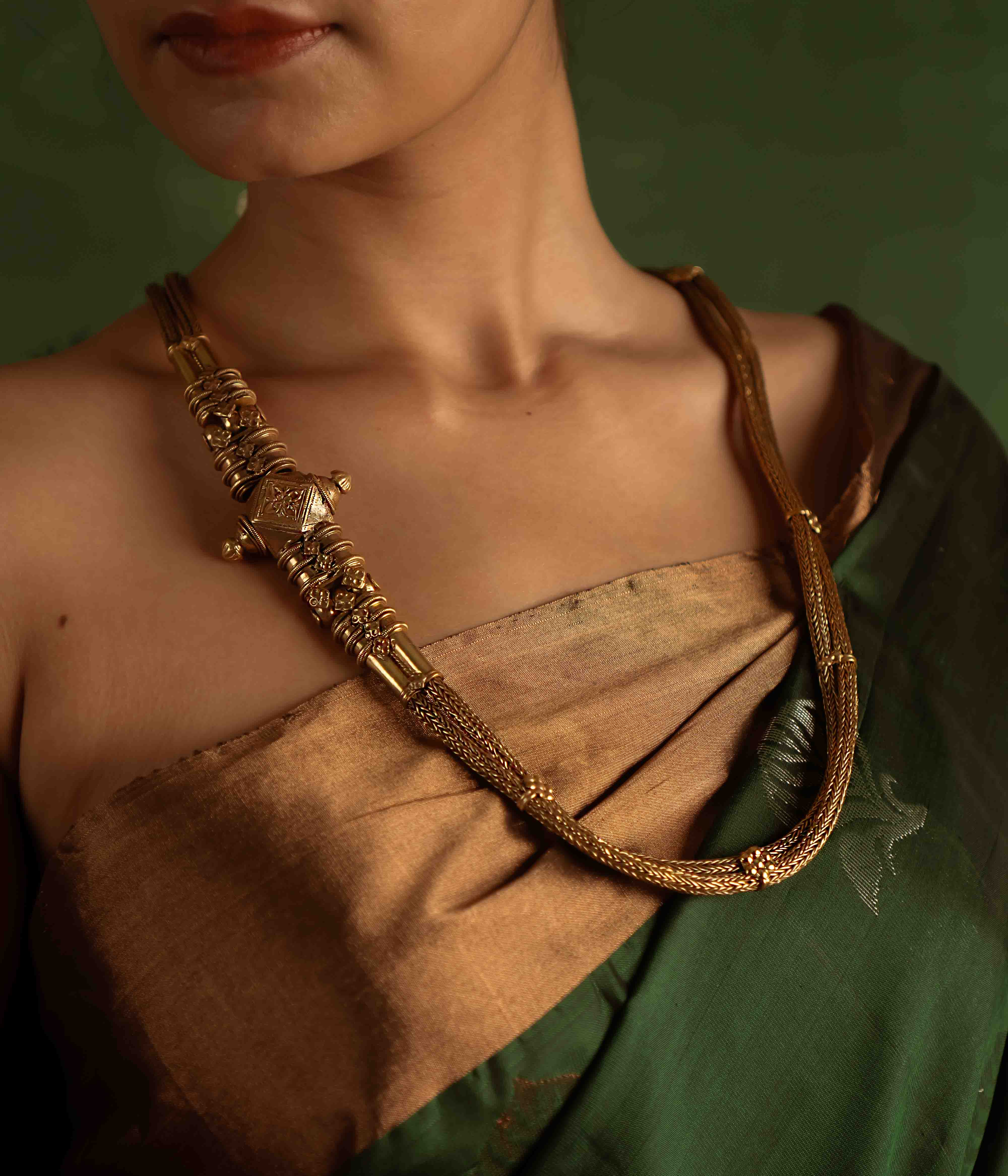 The Paras Necklace (gold-plated silver) revives tribal heritage with bold elegance, embodying strength through its vintage charm.