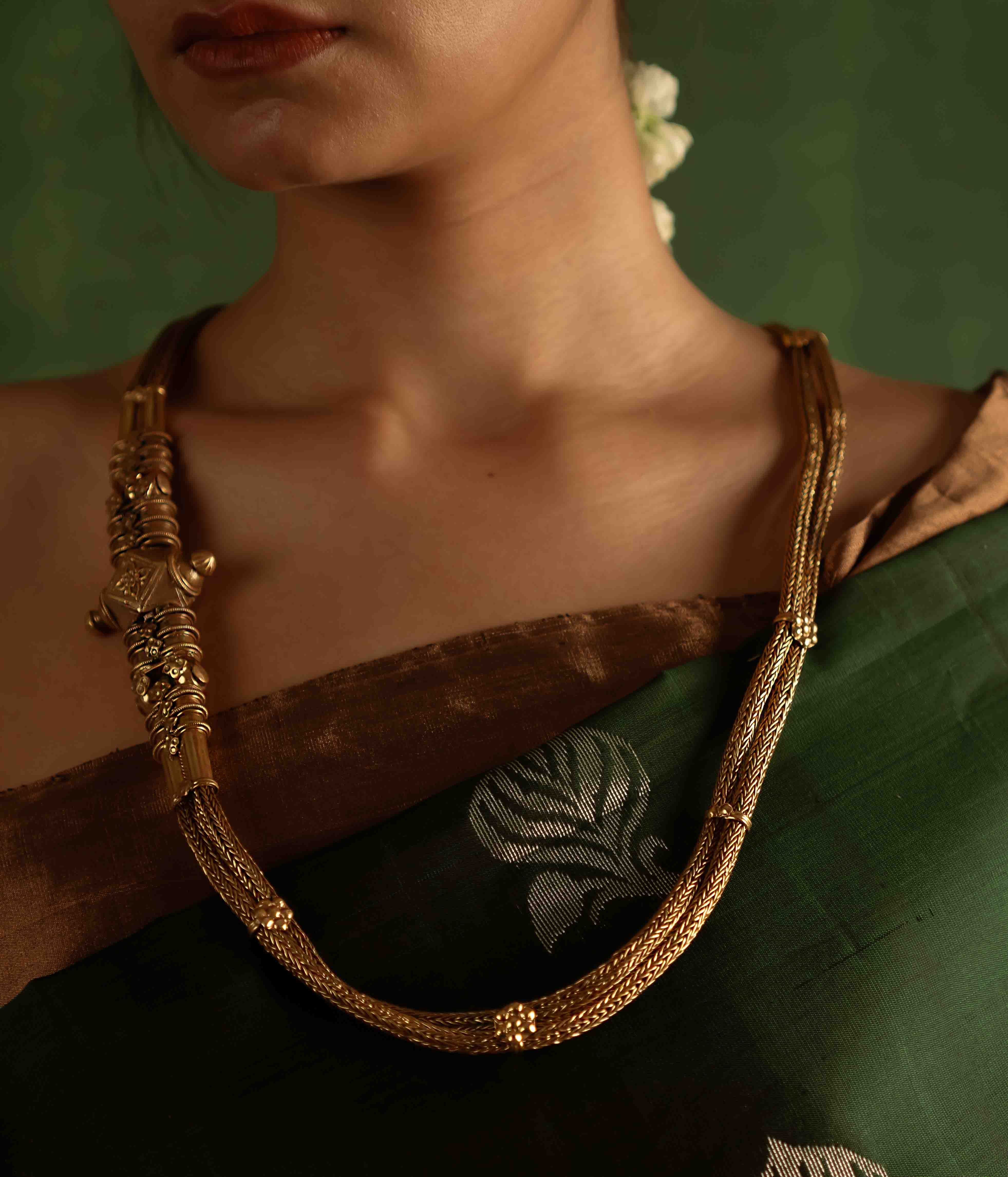 The Paras Necklace (gold-plated silver) revives tribal heritage with bold elegance, embodying strength through its vintage charm.