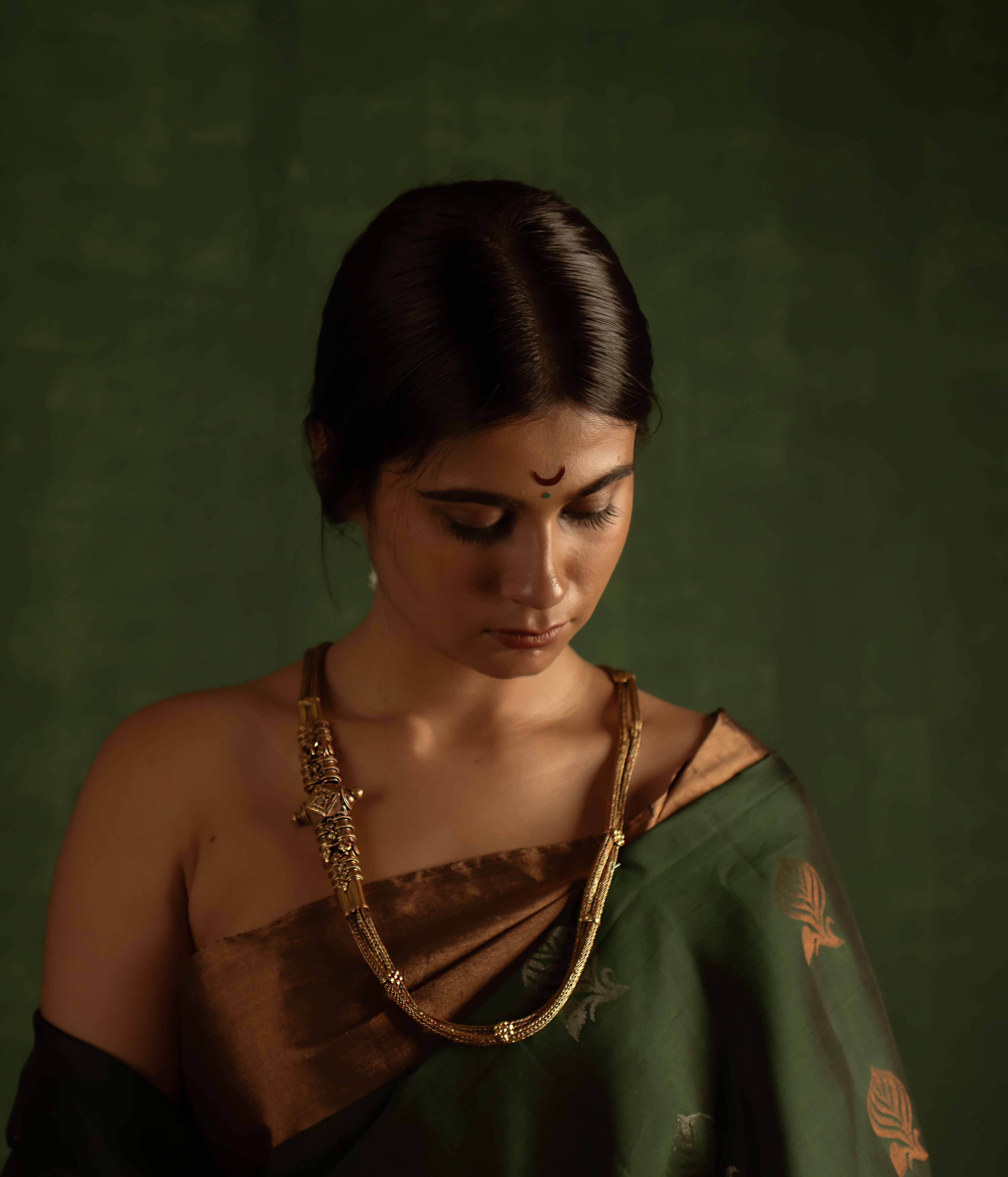 The Paras Necklace (gold-plated silver) revives tribal heritage with bold elegance, embodying strength through its vintage charm.