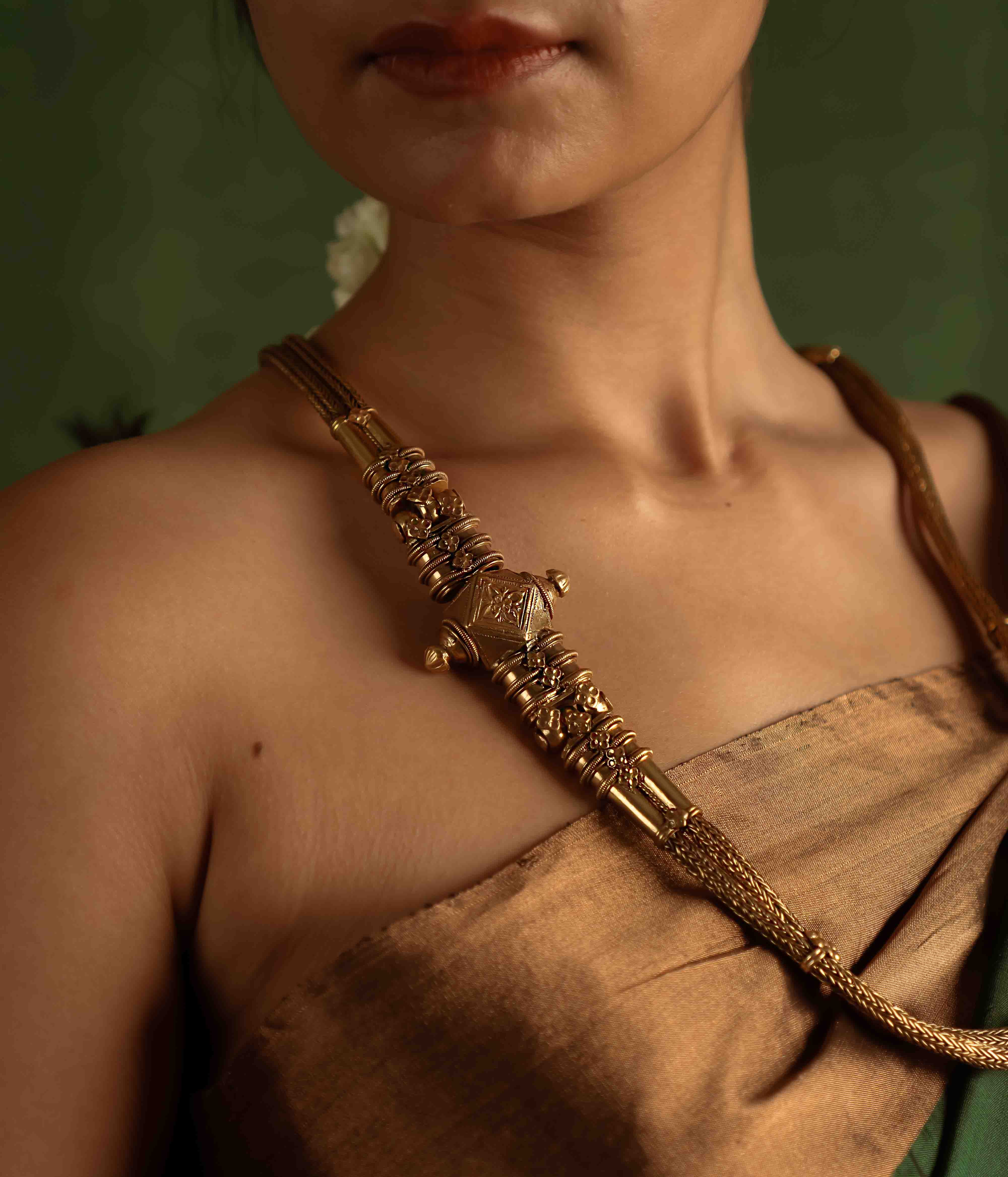The Paras Necklace (gold-plated silver) revives tribal heritage with bold elegance, embodying strength through its vintage charm.