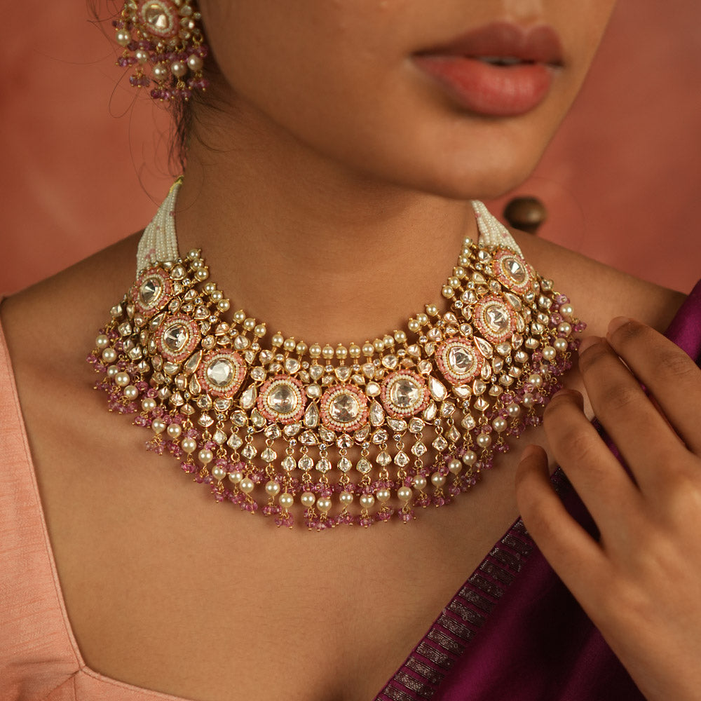 A regal masterpiece! This Moissanite Polki stone necklace, adorned with white pearls and pink beads, radiates timeless elegance. A statement of heritage and modern grace, perfect for the contemporary bride.
