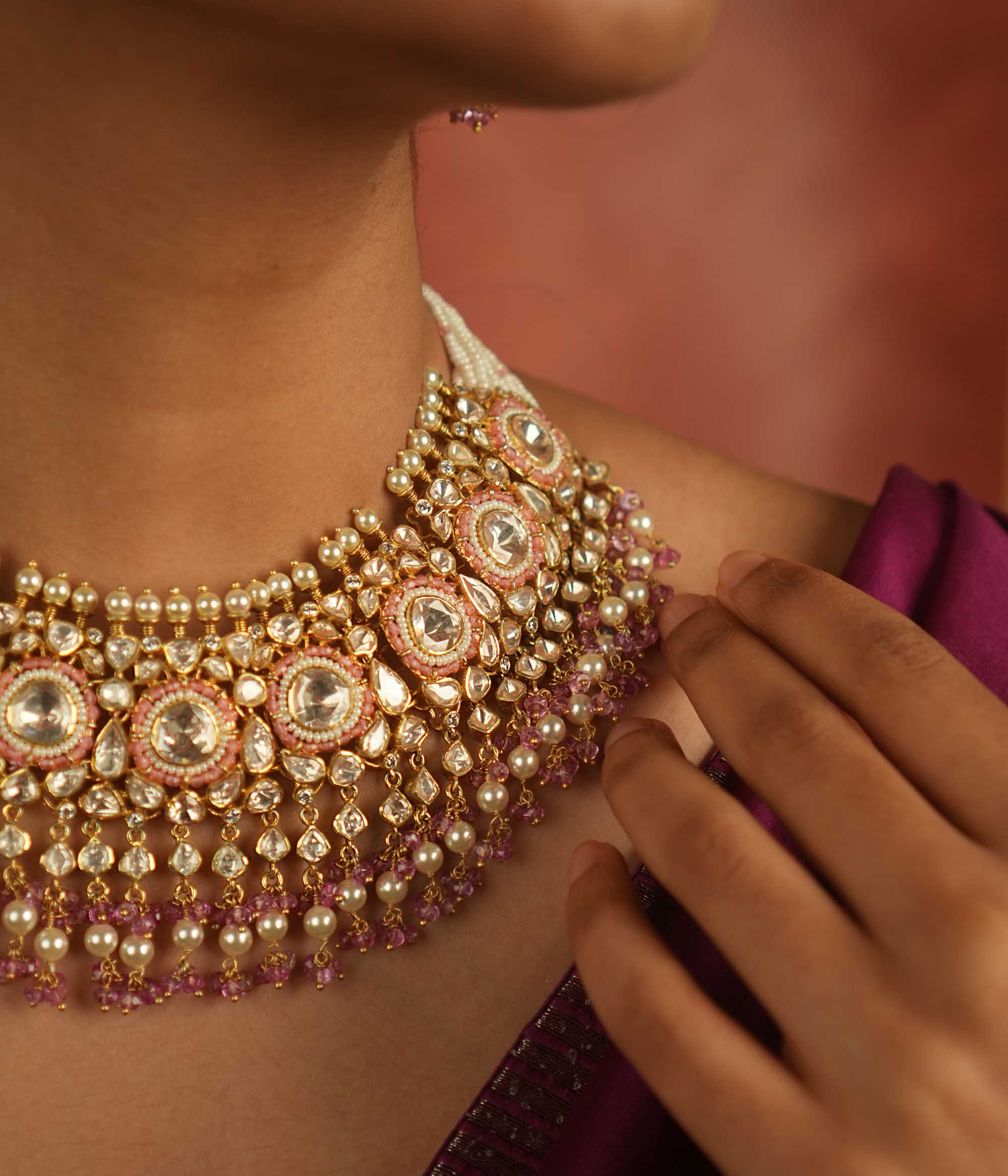 A regal masterpiece! This Moissanite Polki stone necklace, adorned with white pearls and pink beads, radiates timeless elegance. A statement of heritage and modern grace, perfect for the contemporary bride.