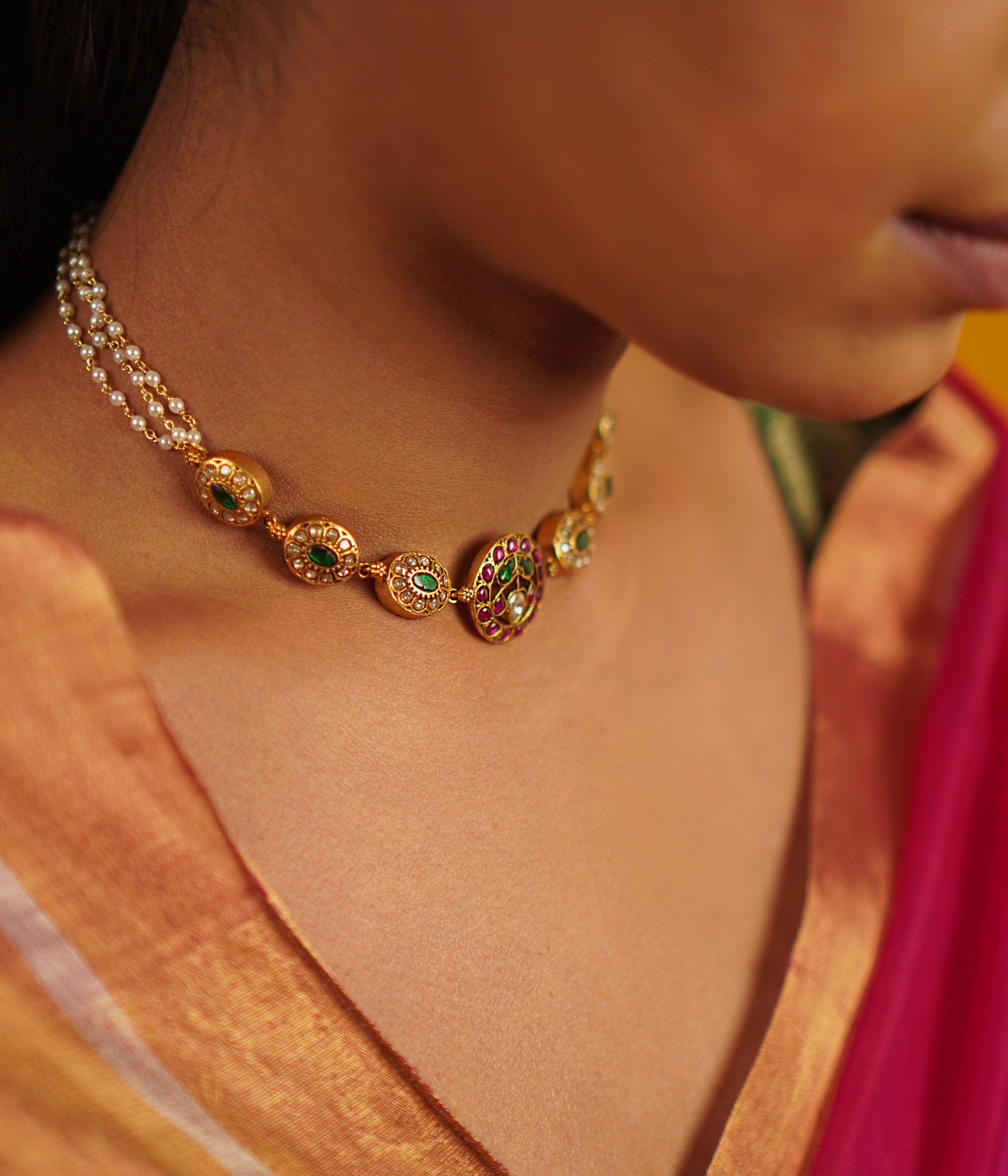 This antique silver choker, embellished with vibrant kundans, captures the delight of uncovering hidden treasures. A seamless fusion of tradition and charm, this piece embodies timeless elegance.