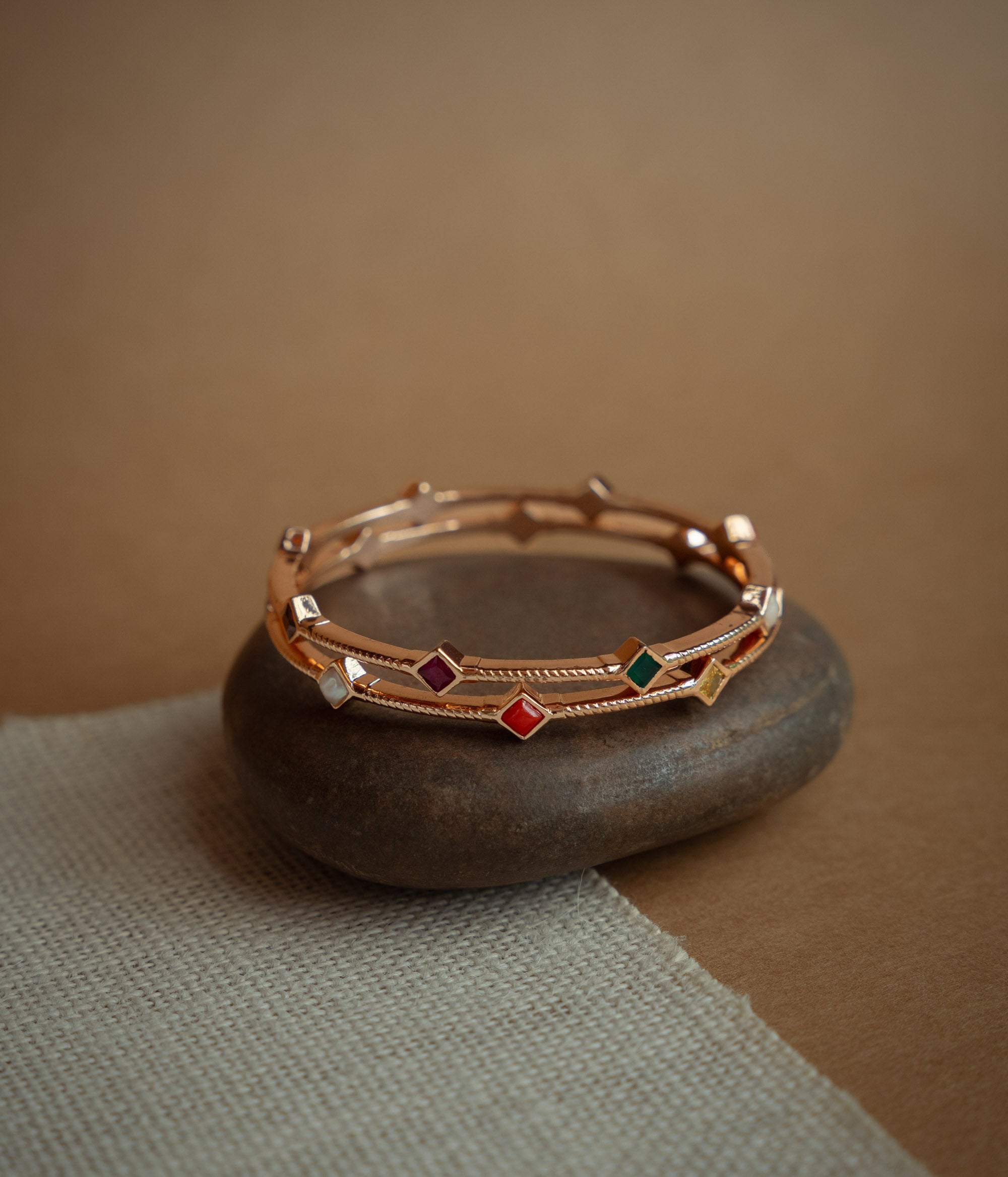Close up view of navaratna stones in silver bangle