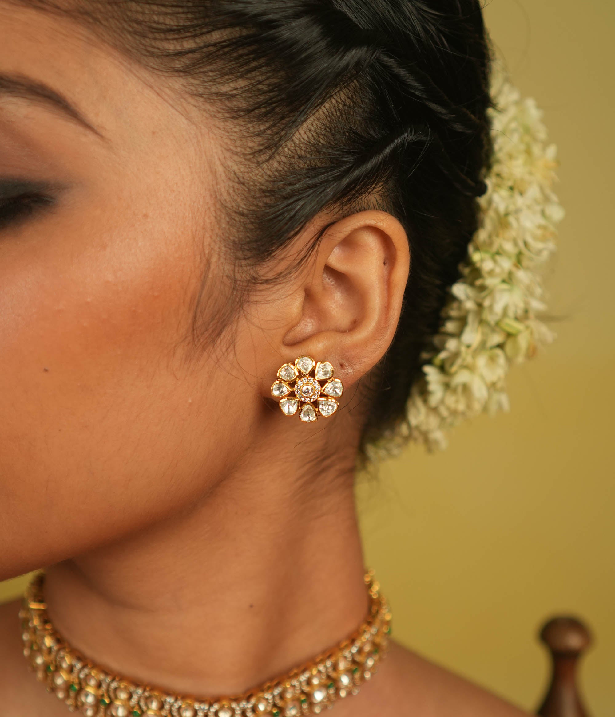 Floral whispers reborn! Minimal Polki stud earring blossoms with timeless grace, a cherished gem for the minimalist connoisseur.