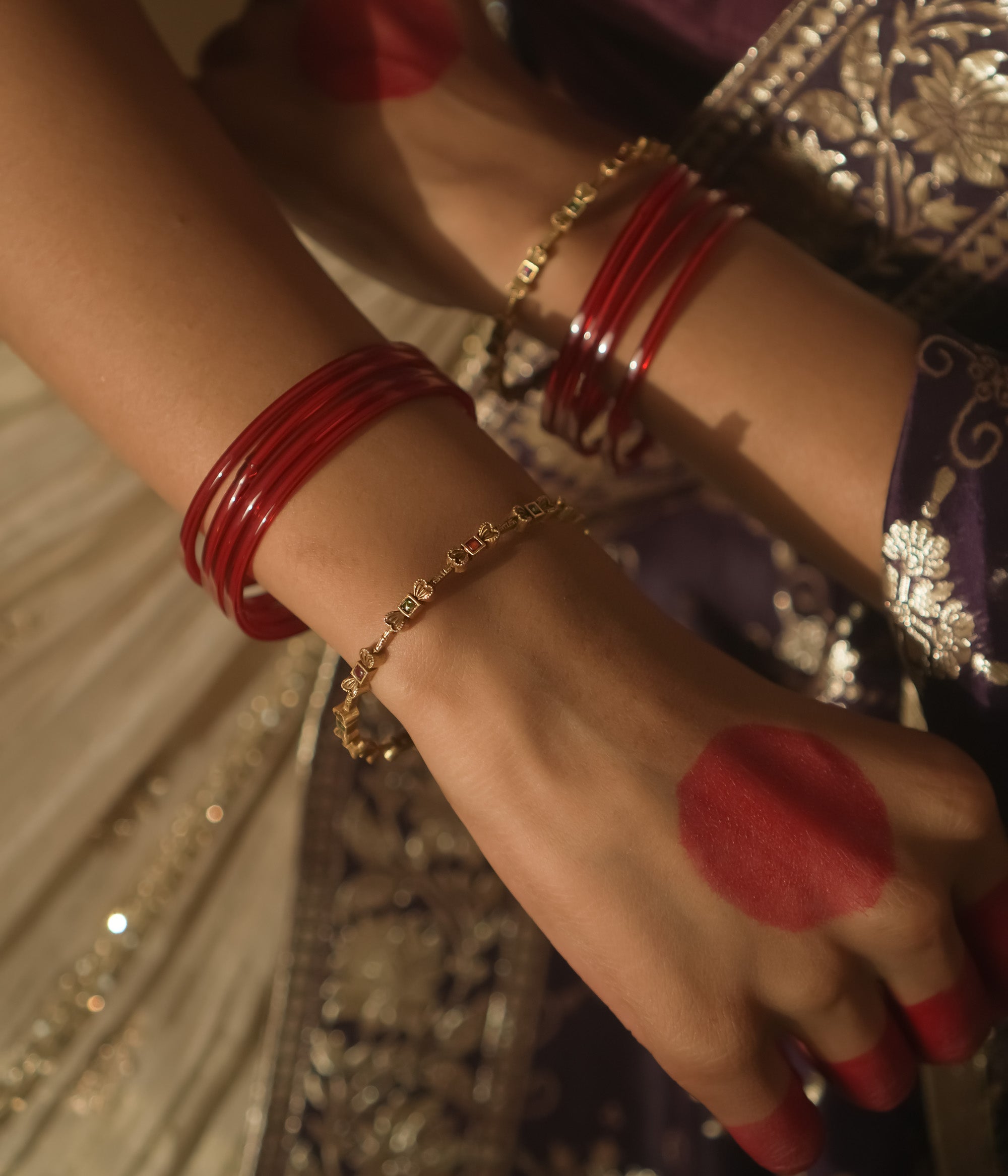 Gold-plated silver bangle with a delicate, twisted chain design.
