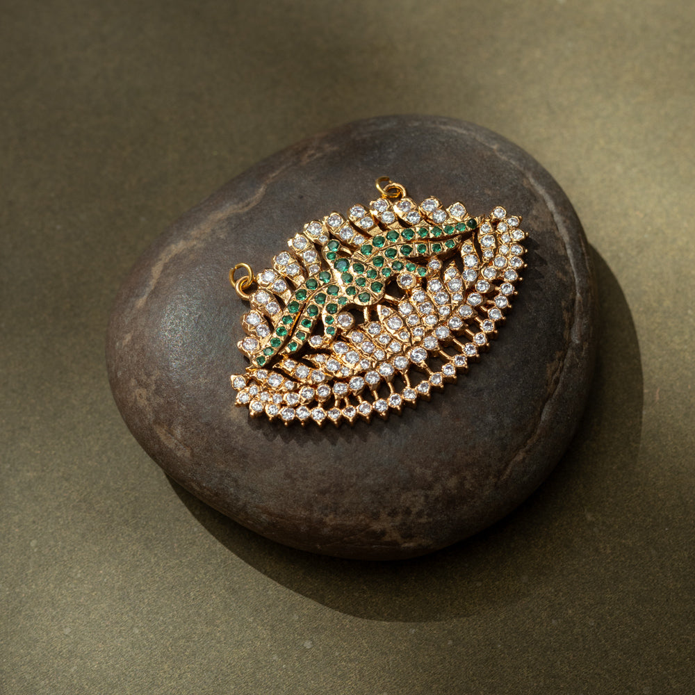 Gold pendant with CZ and green stones in feathered wing shape from the Stone Collection.