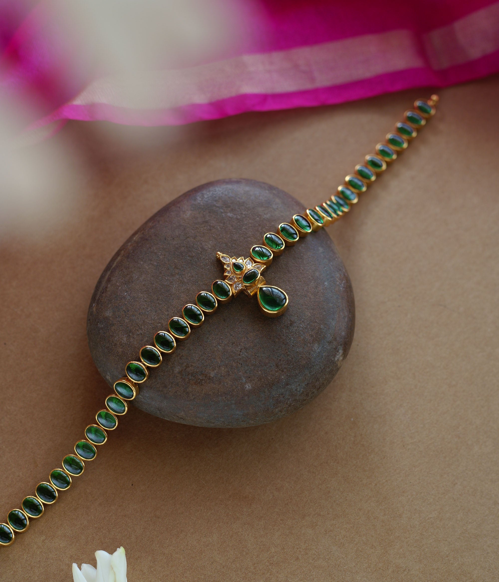 Elegant green stone necklace with center design from Navratna Collection, featuring Swarovski detailing.