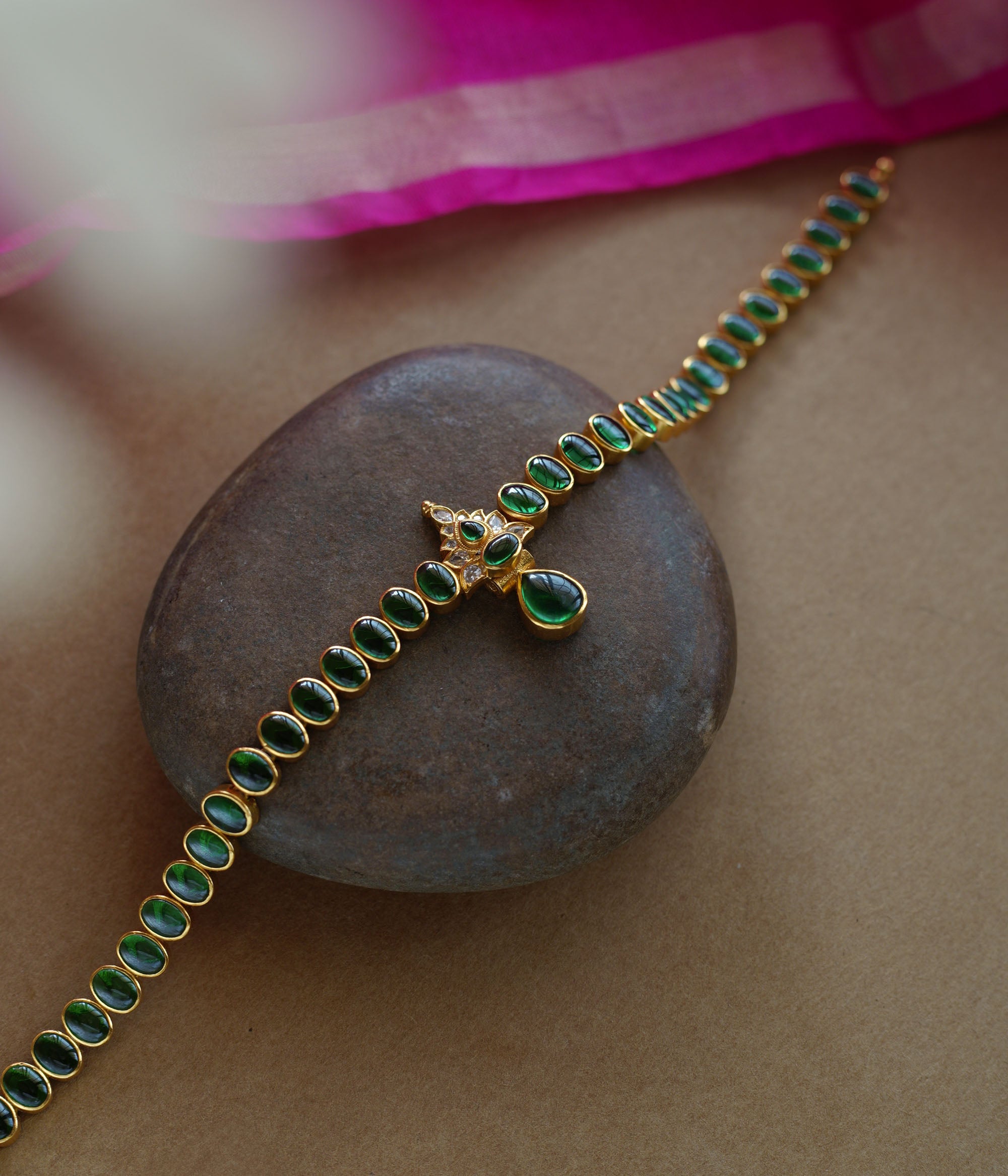 Elegant green stone necklace with center design from Navratna Collection, featuring Swarovski detailing.