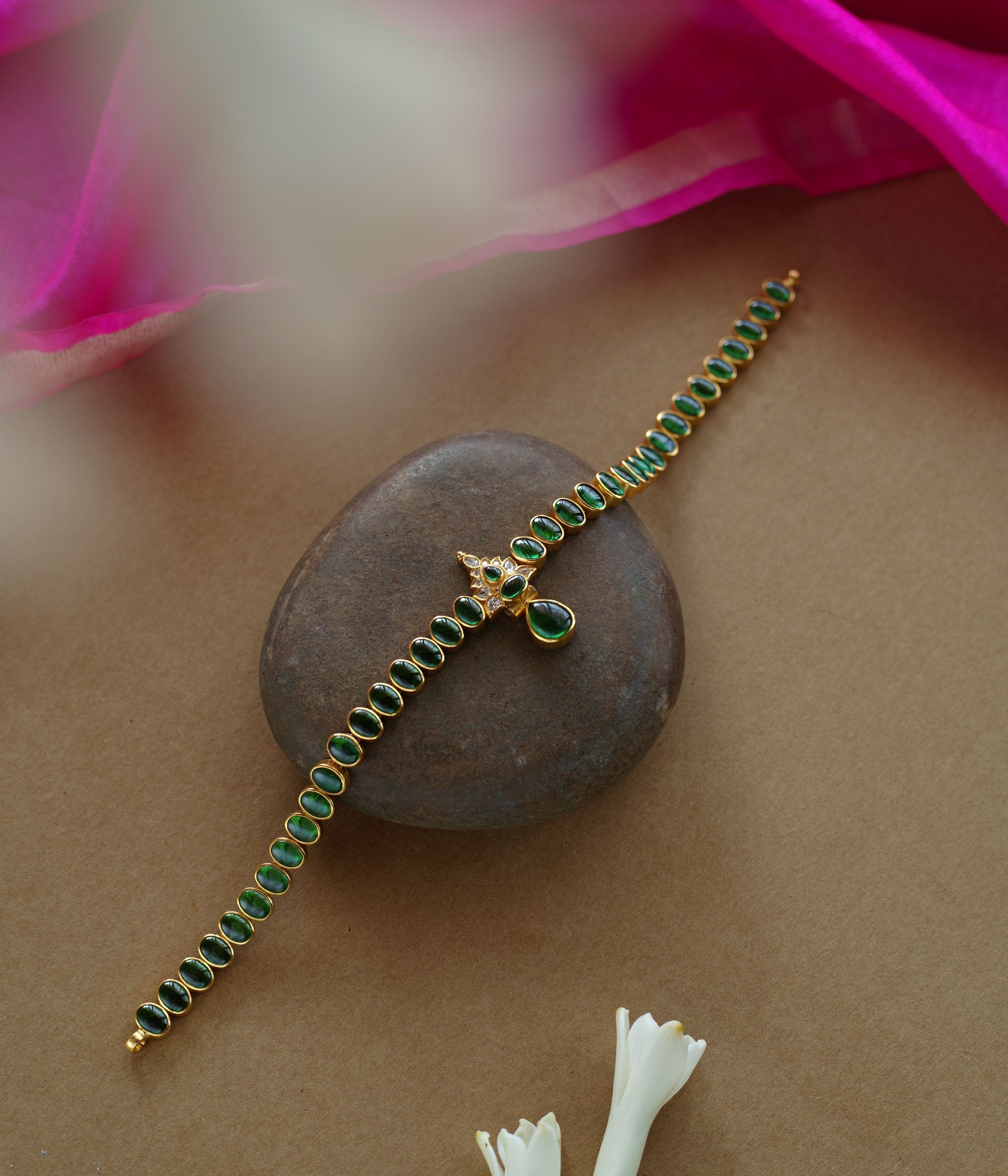 Elegant green stone necklace with center design from Navratna Collection, featuring Swarovski detailing.