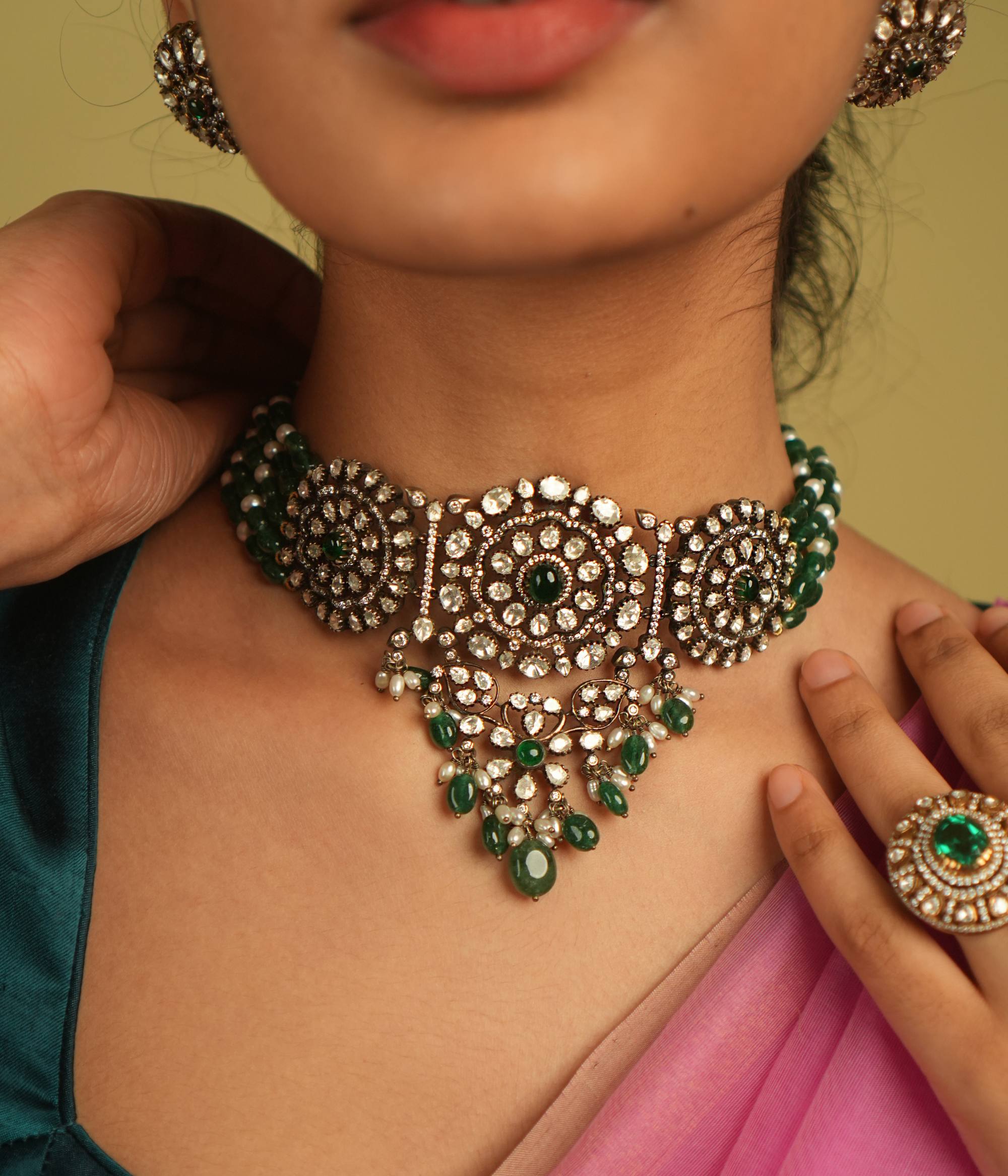Each meticulously set Polki gemstone in this choker echoes the artistry of a bygone era, embodying the essence of regal elegance and timeless charm.