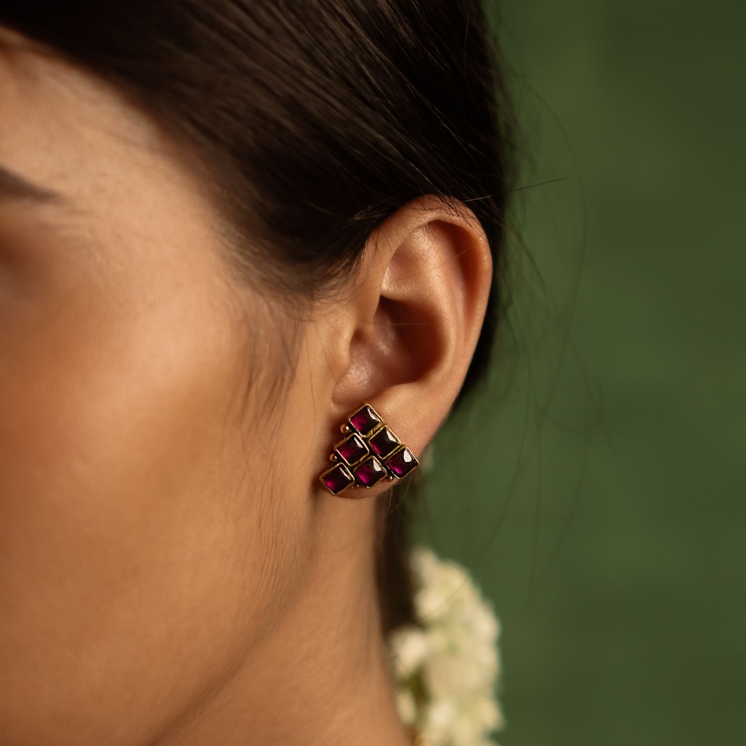 Illuminate your style with the timeless charm of these Sashi gold-plated silver earrings, adorned with red Kundan stones—a tribute to regal grandeur and cultural heritage.