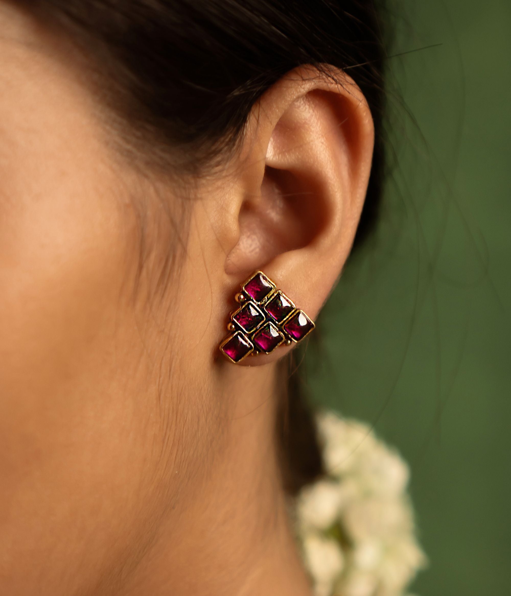 Illuminate your style with the timeless charm of these Sashi gold-plated silver earrings, adorned with red Kundan stones—a tribute to regal grandeur and cultural heritage.