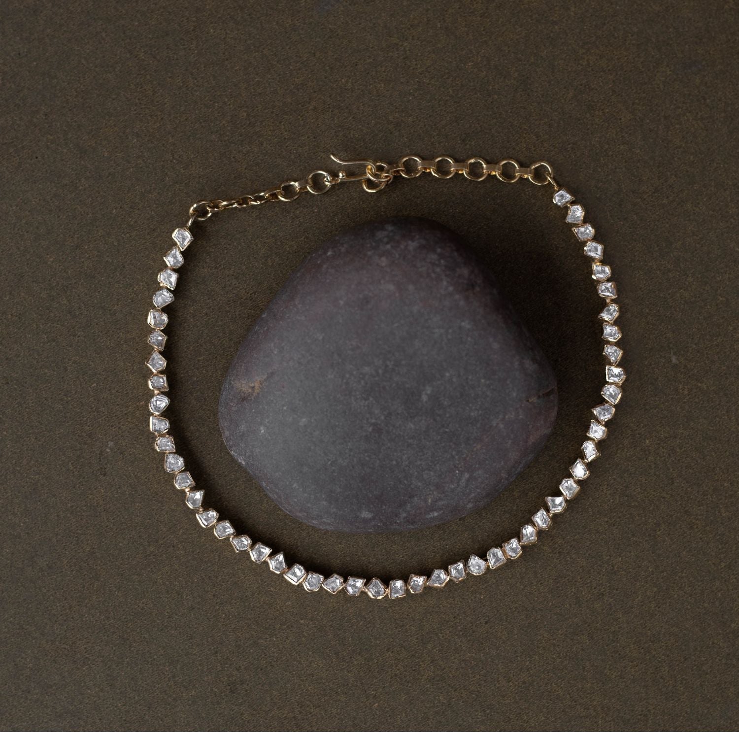 A regal masterpiece, the Savya Choker, a symphony of Polki, a timeless legacy.