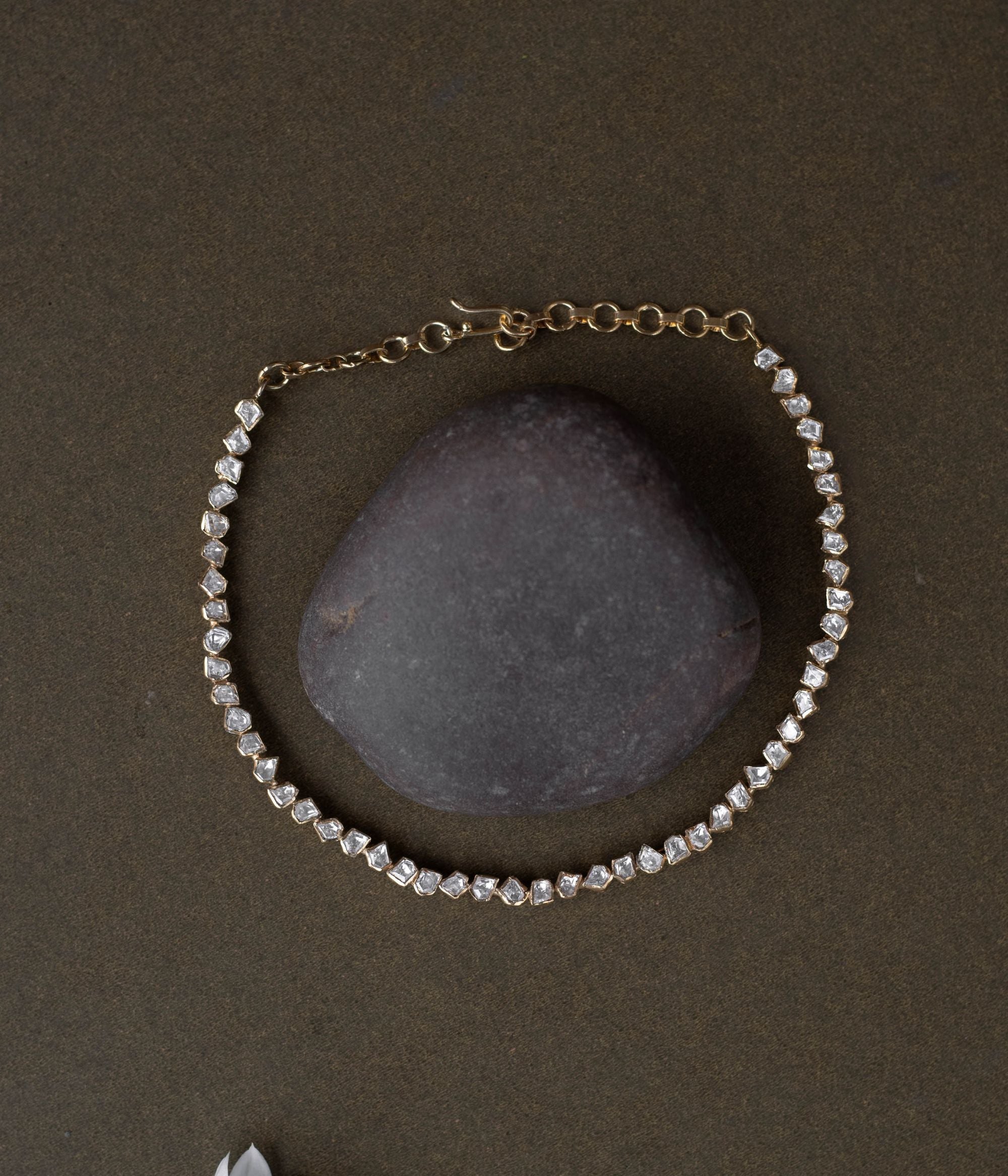 A regal masterpiece, the Savya Choker, a symphony of Polki, a timeless legacy.