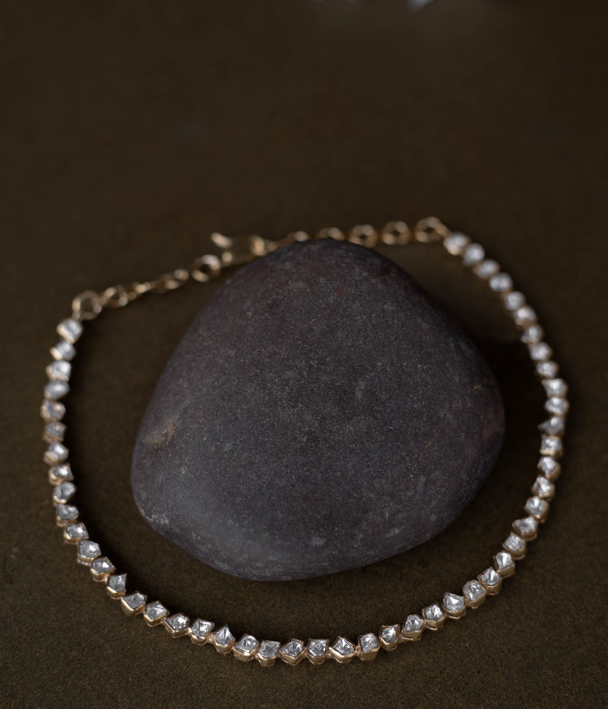 A regal masterpiece, the Savya Choker, a symphony of Polki, a timeless legacy.
