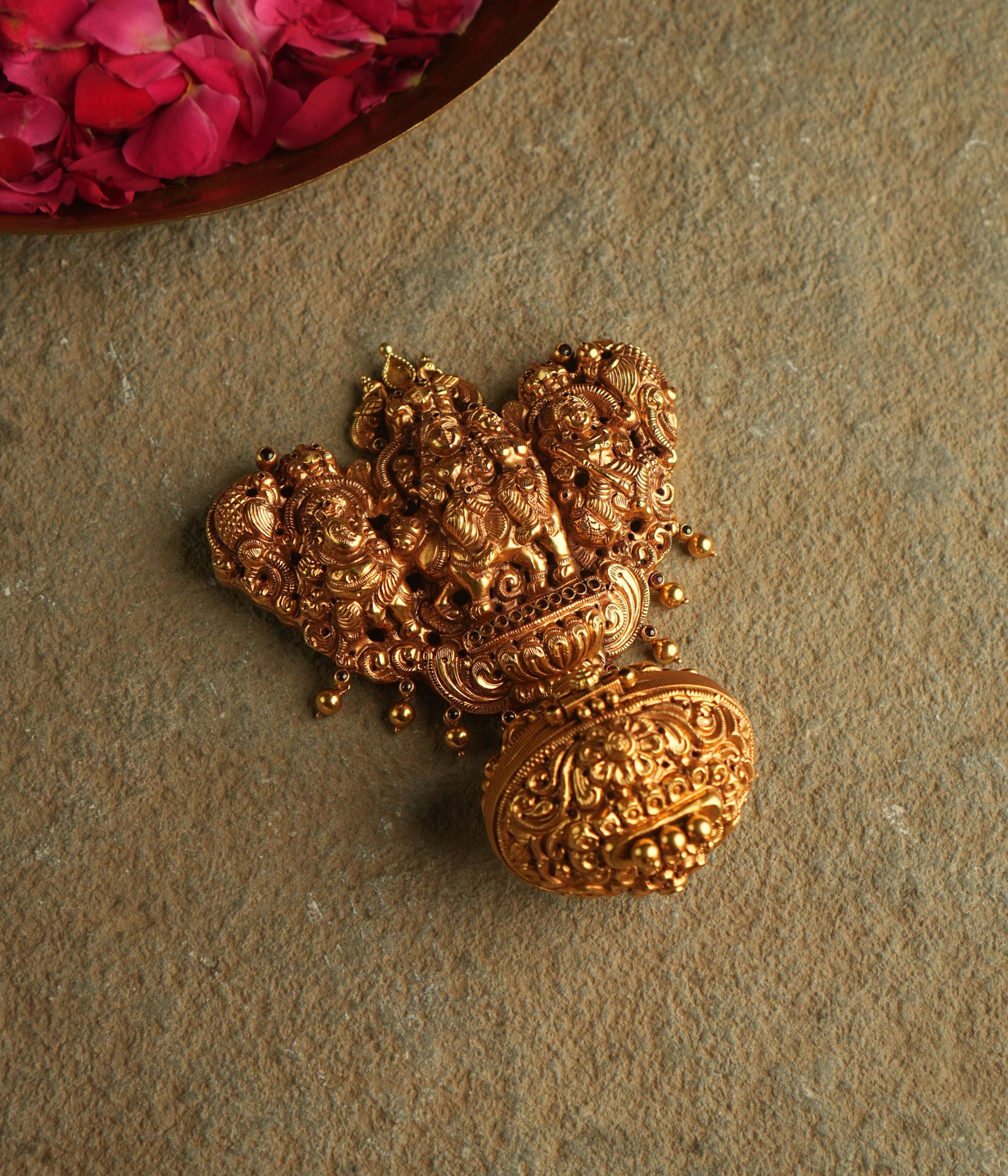 In the sacred aura of this gold-plated silver pendant, Lord Shiva and Goddess Parvati stand in divine harmony, their celestial union representing the eternal balance of the cosmos.