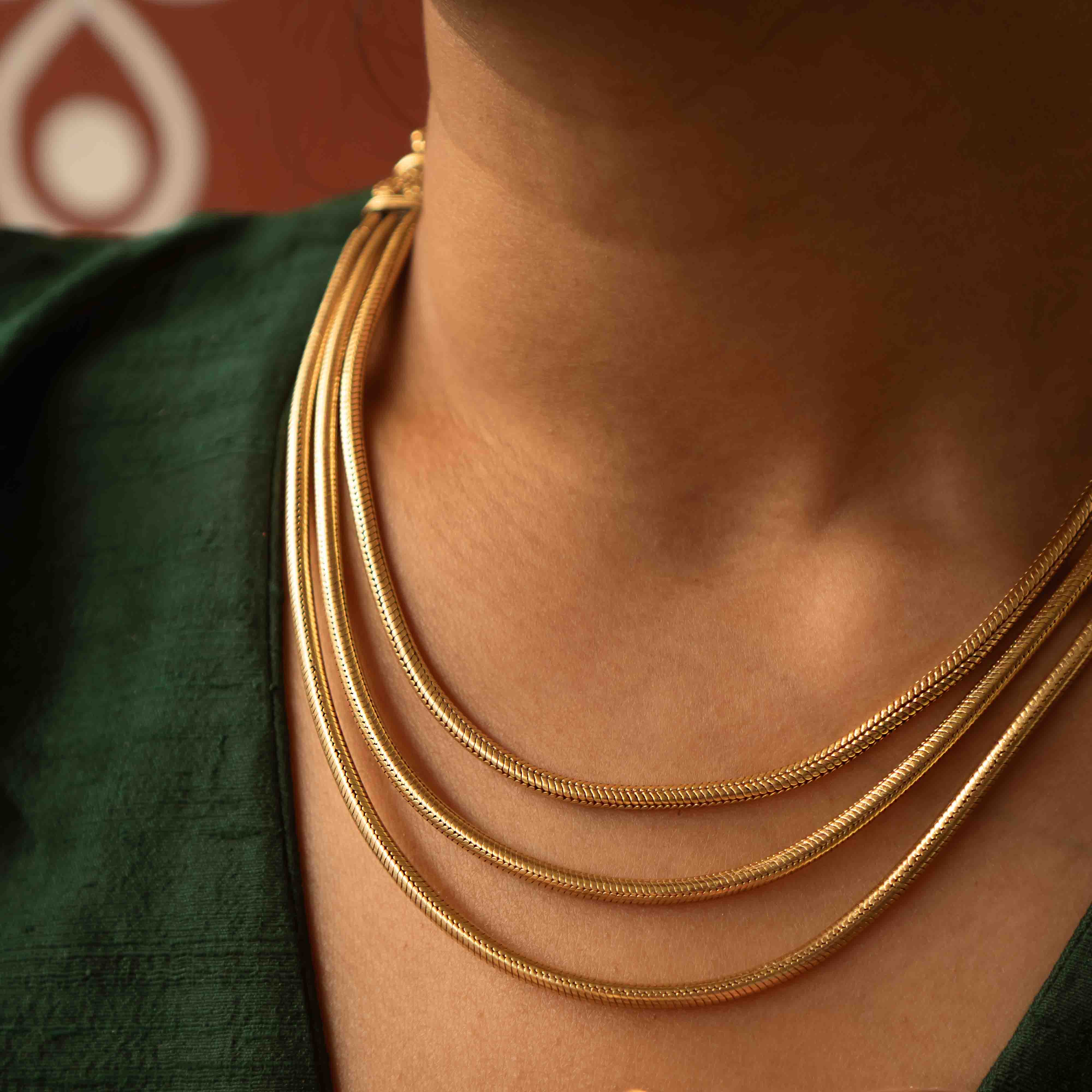 Tribal elegance reimagined! The Shaleena necklace (gold-plated silver) exudes timeless beauty across three delicate layers, offering effortless grace for the modern woman.