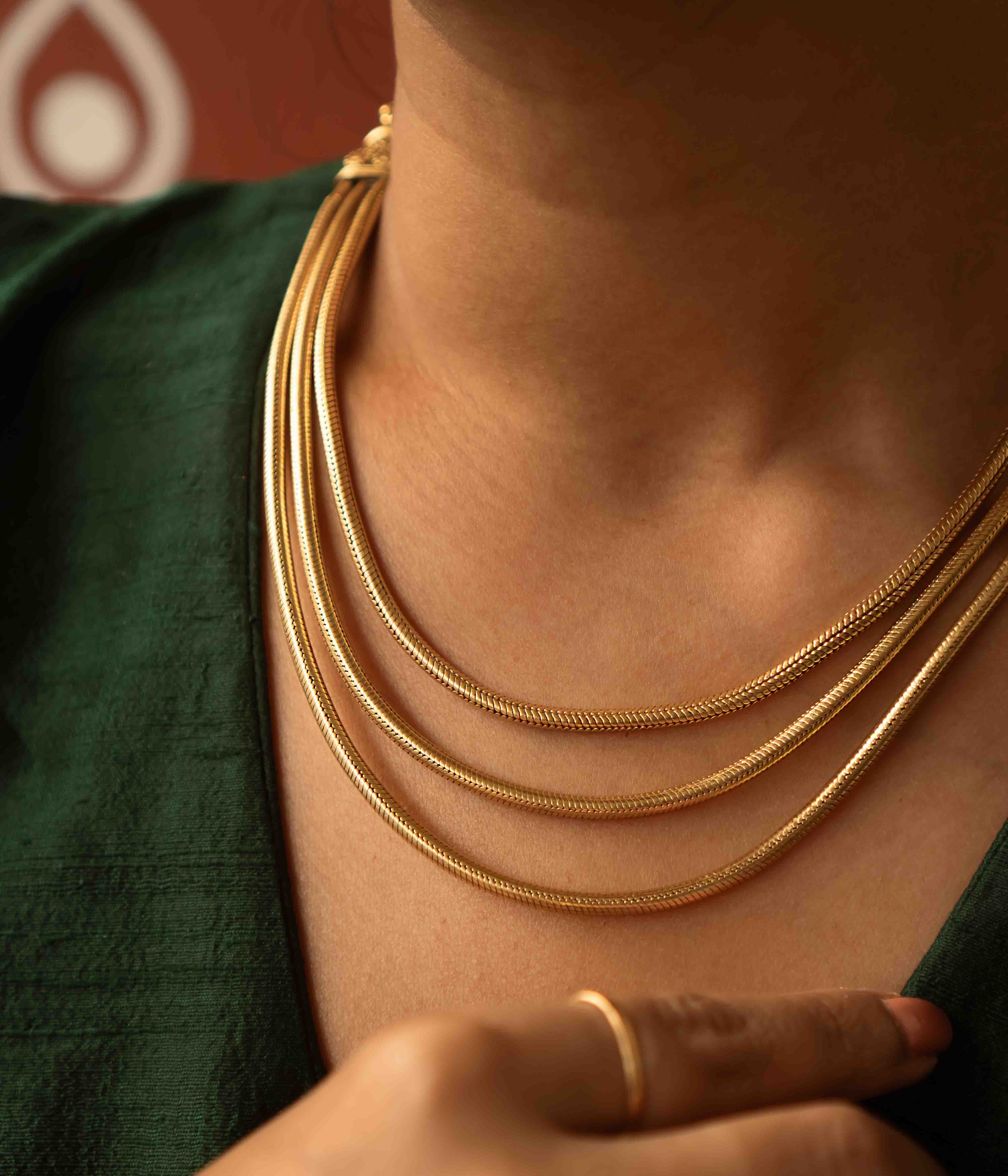Tribal elegance reimagined! The Shaleena necklace (gold-plated silver) exudes timeless beauty across three delicate layers, offering effortless grace for the modern woman.