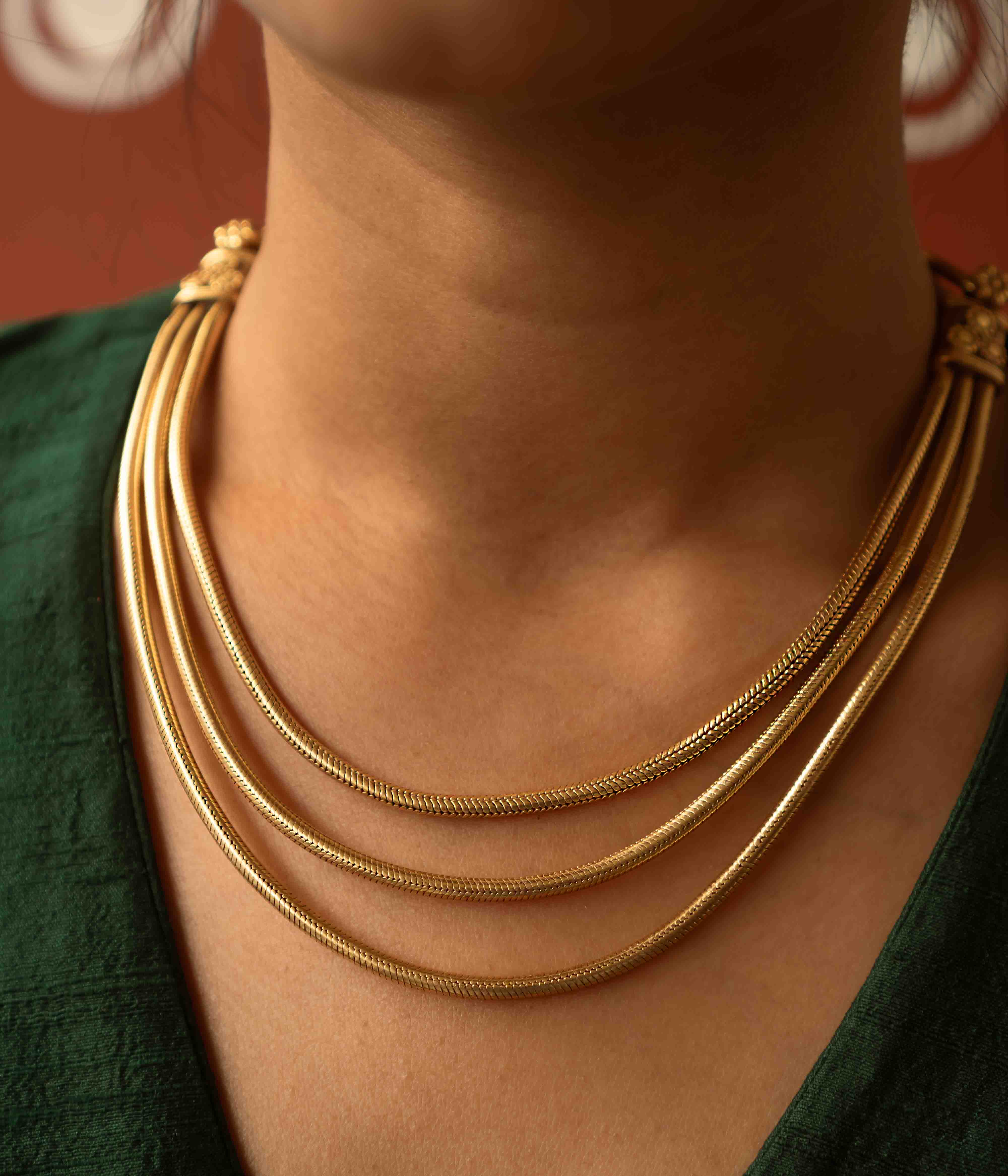 Tribal elegance reimagined! The Shaleena necklace (gold-plated silver) exudes timeless beauty across three delicate layers, offering effortless grace for the modern woman.