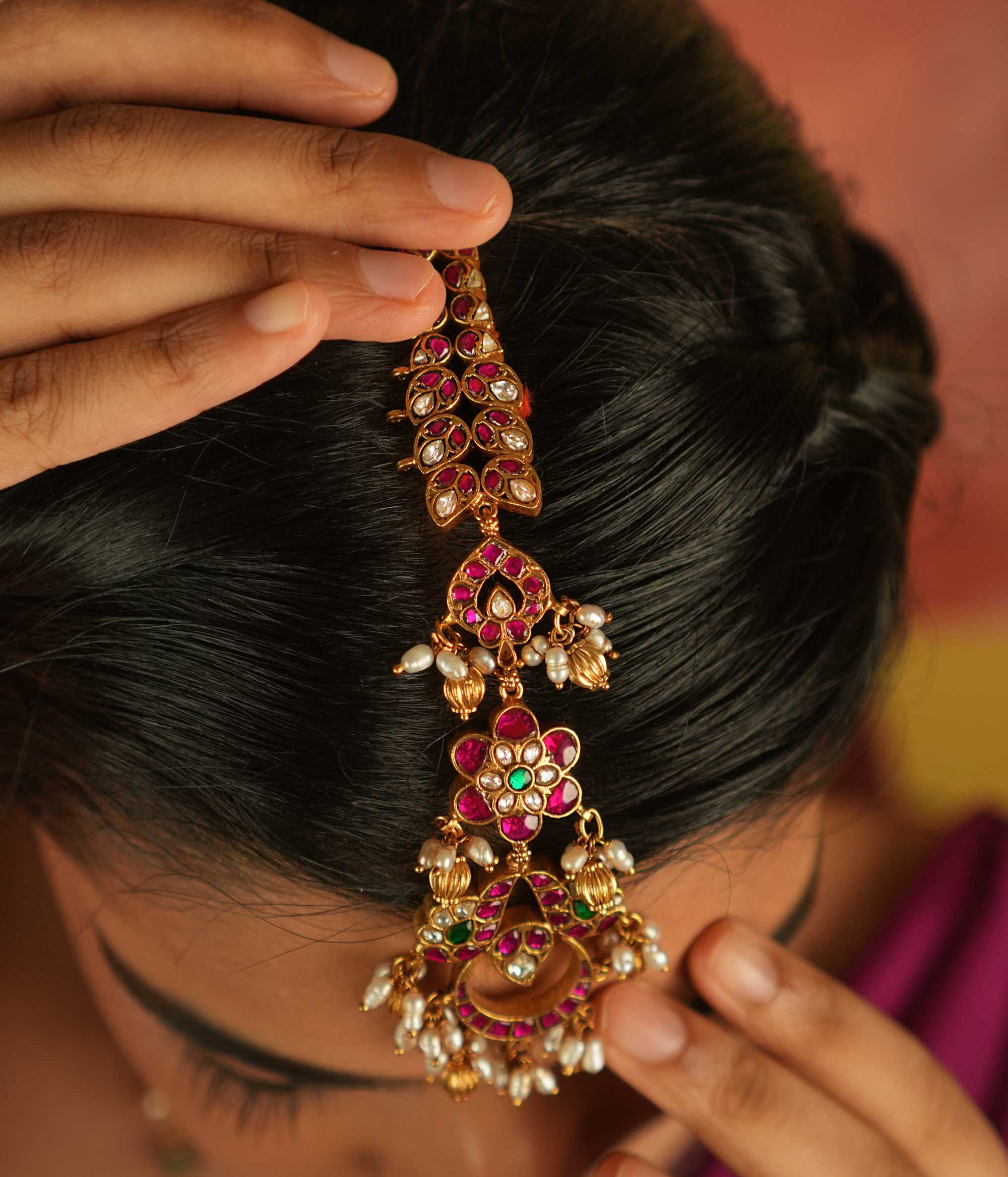 Ethereal bloom reborn! A floral Kundan maangtika adorned with pearls and red beads, where celestial grace meets timeless splendor.