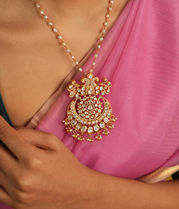 Illuminate your style with this stunning pendant, featuring Moissanite Polki stones, CZ stones, and a beautiful peacock motif. A radiant symbol of timeless elegance, it reflects exquisite craftsmanship and a rich tradition of beauty.