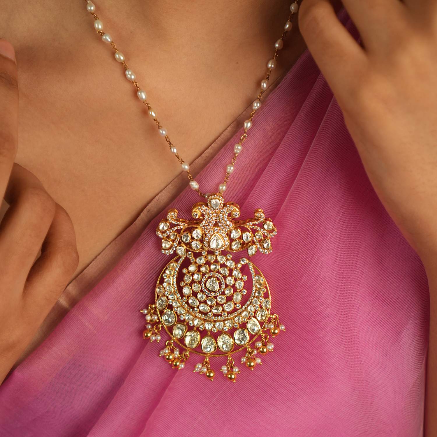 Illuminate your style with this stunning pendant, featuring Moissanite Polki stones, CZ stones, and a beautiful peacock motif. A radiant symbol of timeless elegance, it reflects exquisite craftsmanship and a rich tradition of beauty.