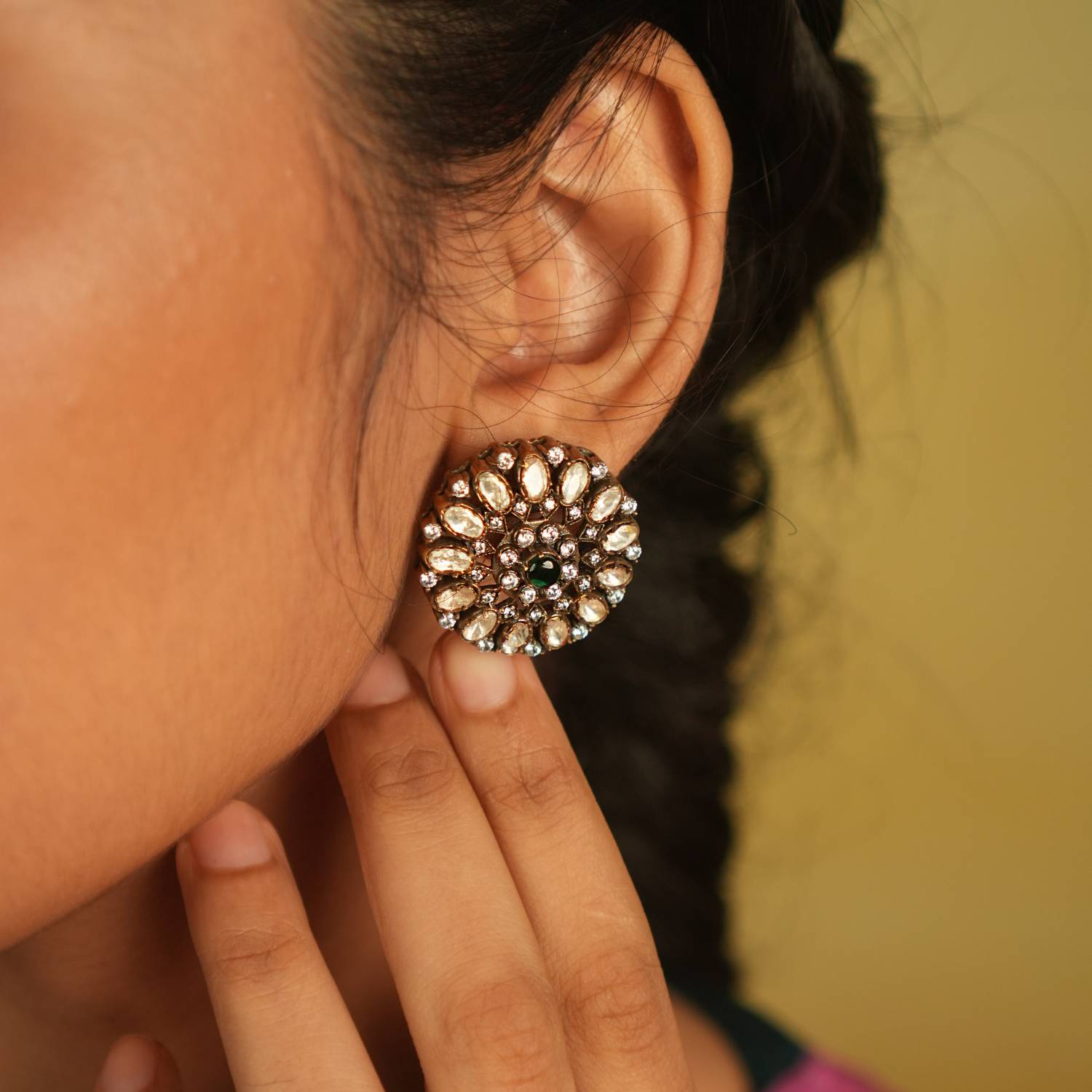 Victorian-inspired Moissanite stud earrings bloom with a captivating green spinel center, encircled by radiant polki and CZ stones, evoking timeless opulence.