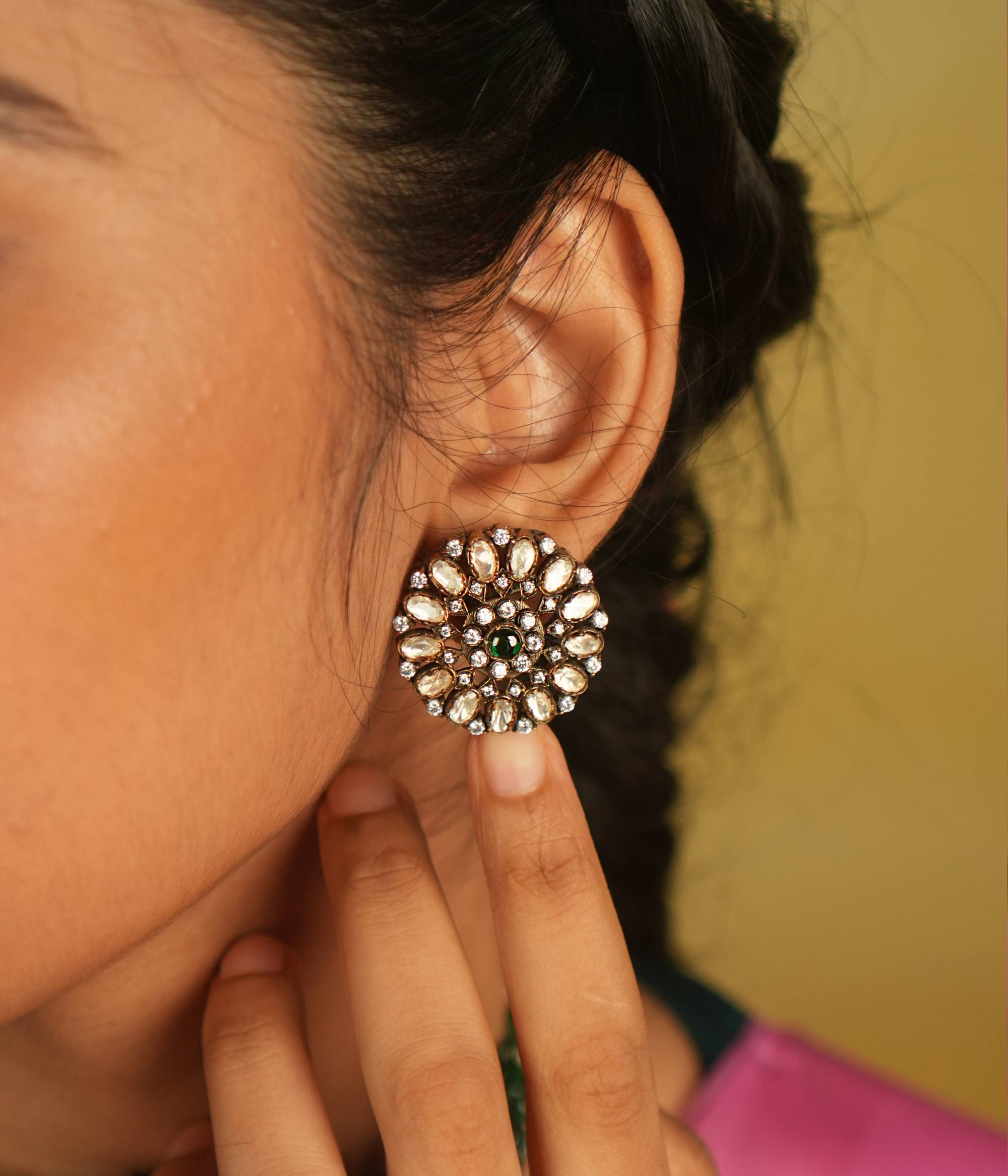 Victorian-inspired Moissanite stud earrings bloom with a captivating green spinel center, encircled by radiant polki and CZ stones, evoking timeless opulence.