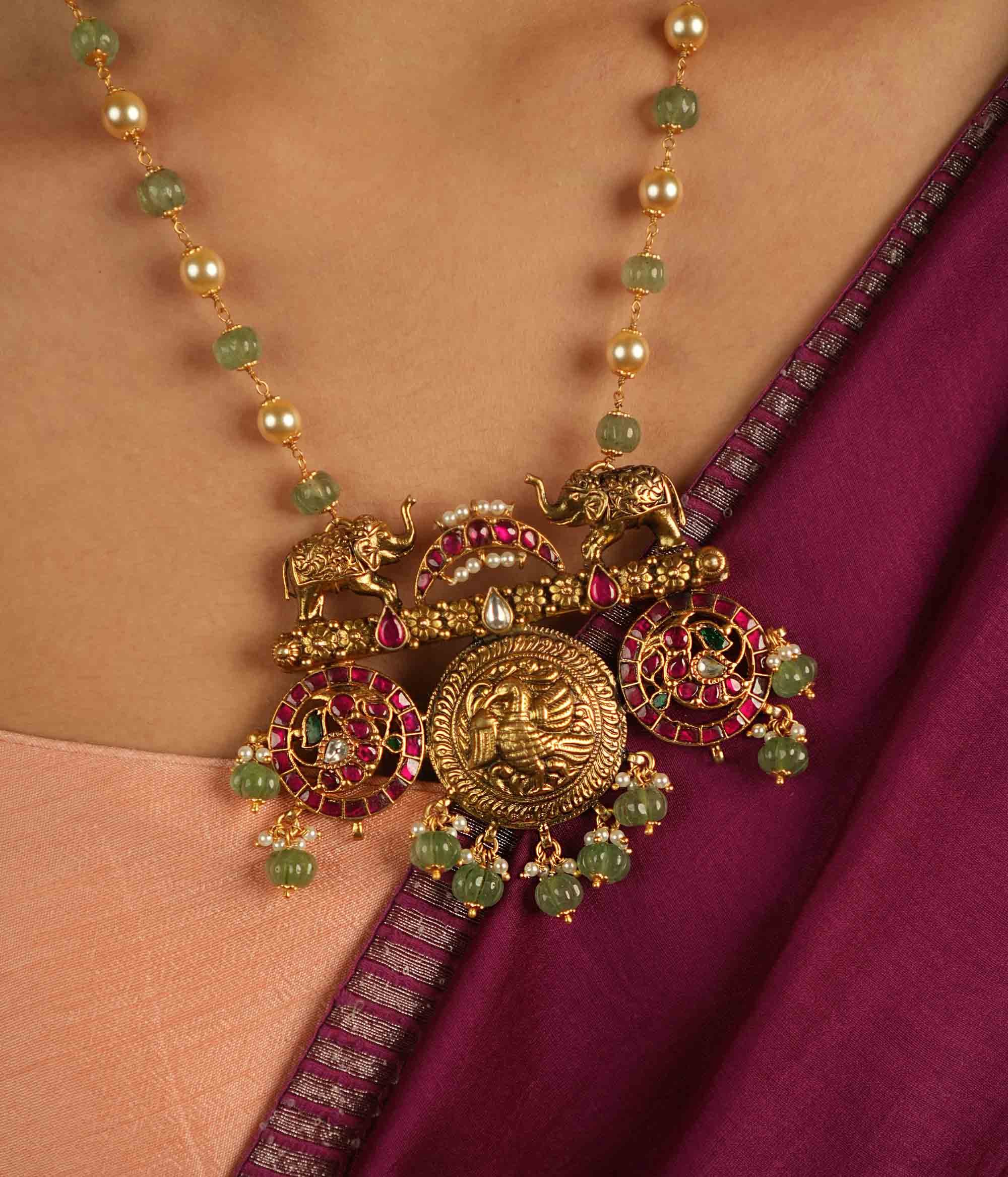 Regal menagerie reborn! Kundan necklace with peacock and elephant motifs whispers tales of opulence through vibrant hues—a timeless treasure.