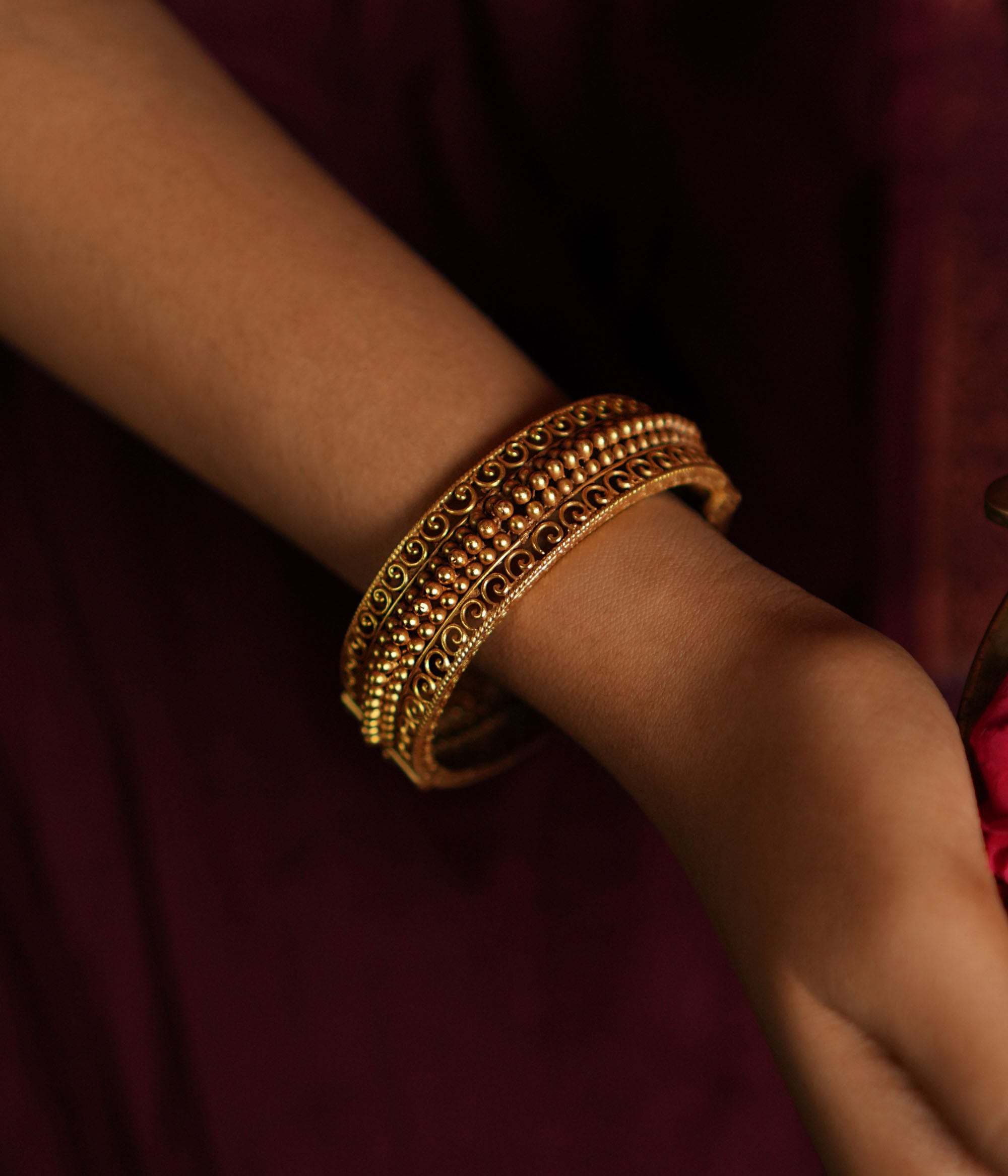 Close-up of Avery Kada with delicate gold beads