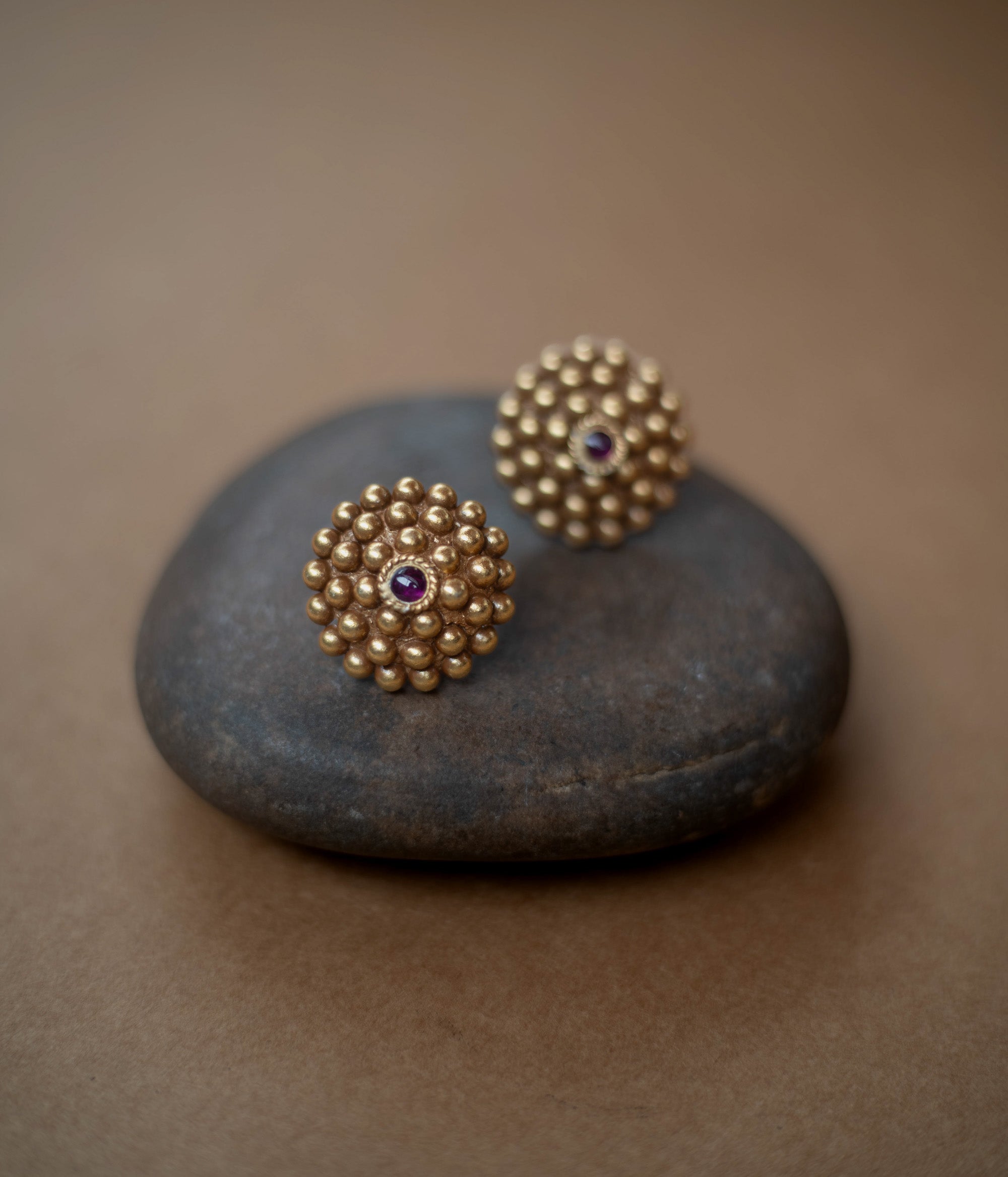 Tribal-style Rudhra earrings featuring red spinel stones, made in 92.5 sterling silver with 22ct gold plating.