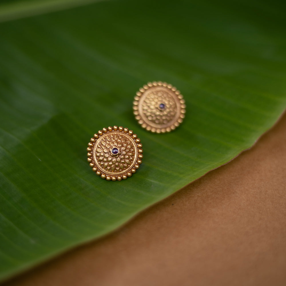 Mithra earrings with red spinel stones, tribal sunburst design in 92.5 sterling silver and 22ct gold plating.